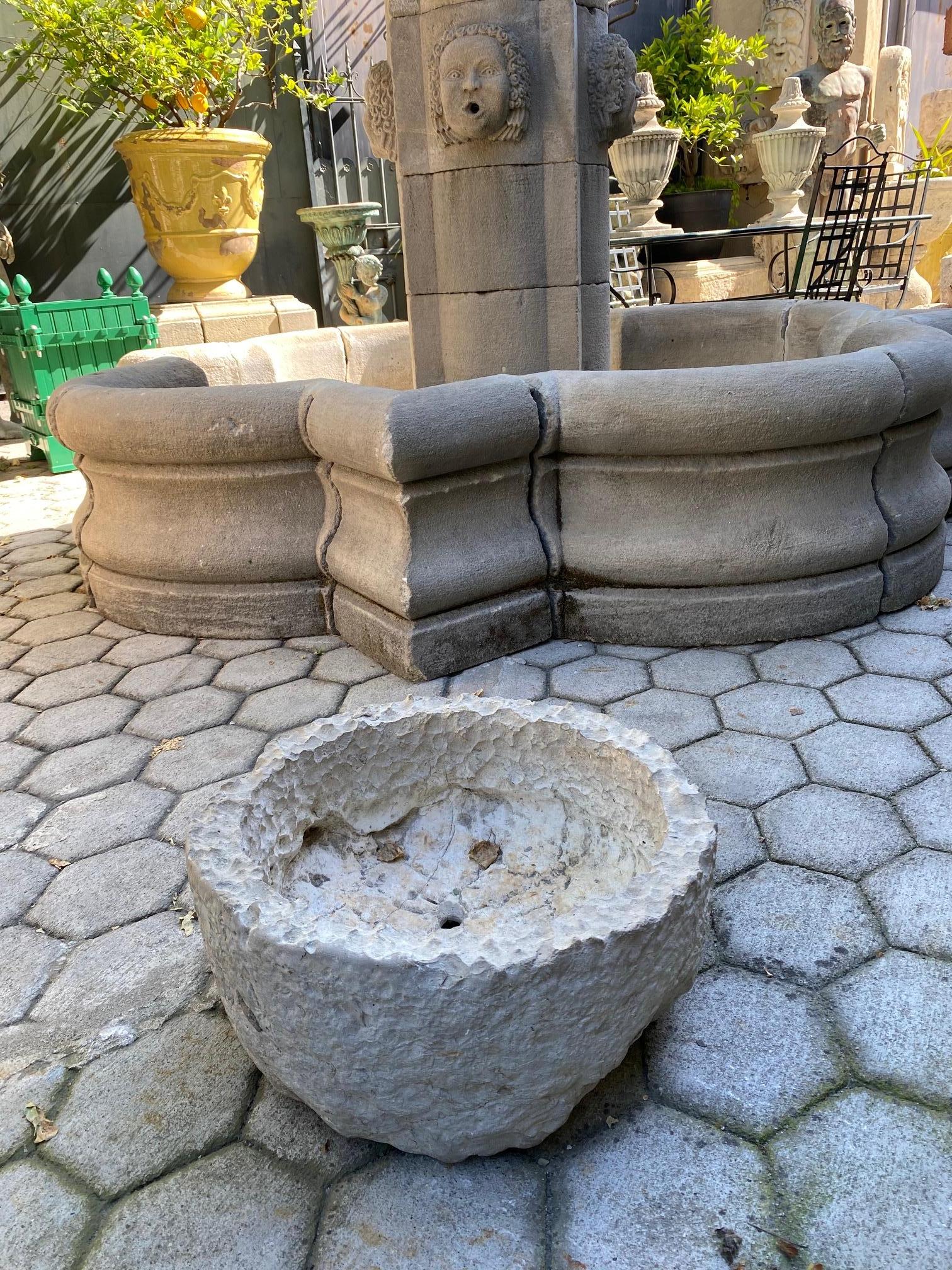A beautiful 18th century hand carved stone container basin having a nicely textured surface and patina. It could be standing alone as a decorative object or used as a planter indoor outdoor. This antique stone vessel mortar planter has a lot of