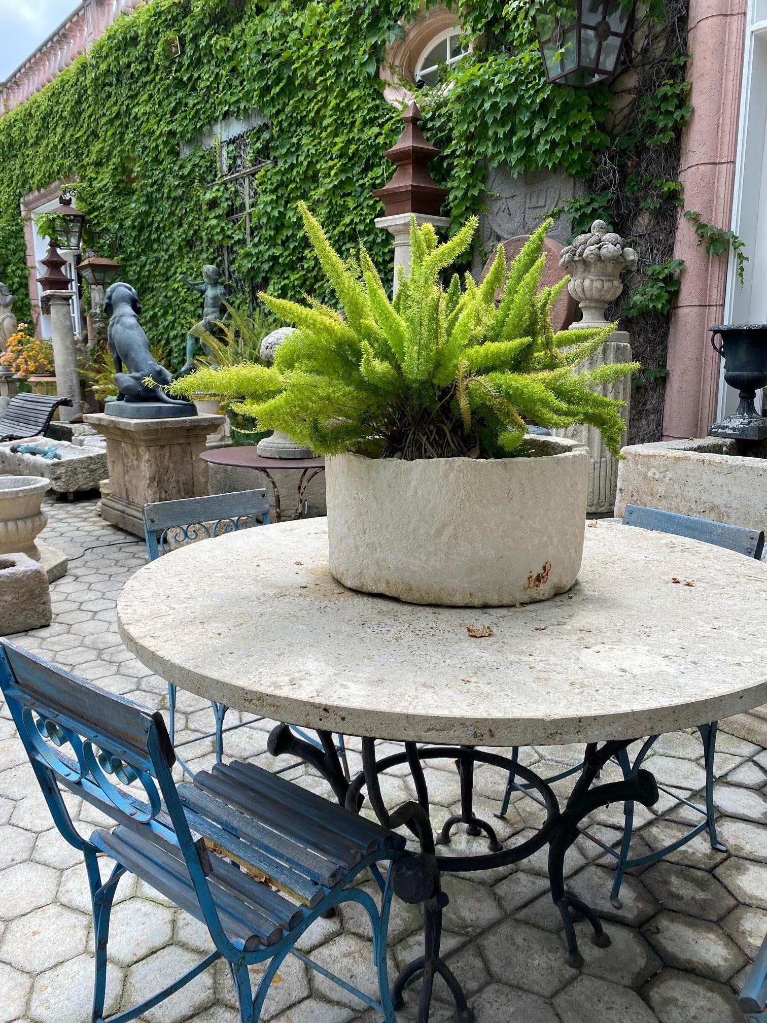 A Beautiful 18th-19th century hand carved stone container basin having a nicely textured surface and patina. It could be standing alone as a decorative object or used as a planter indoor outdoor. This Antique Stone vessel mortar planter has a lot of