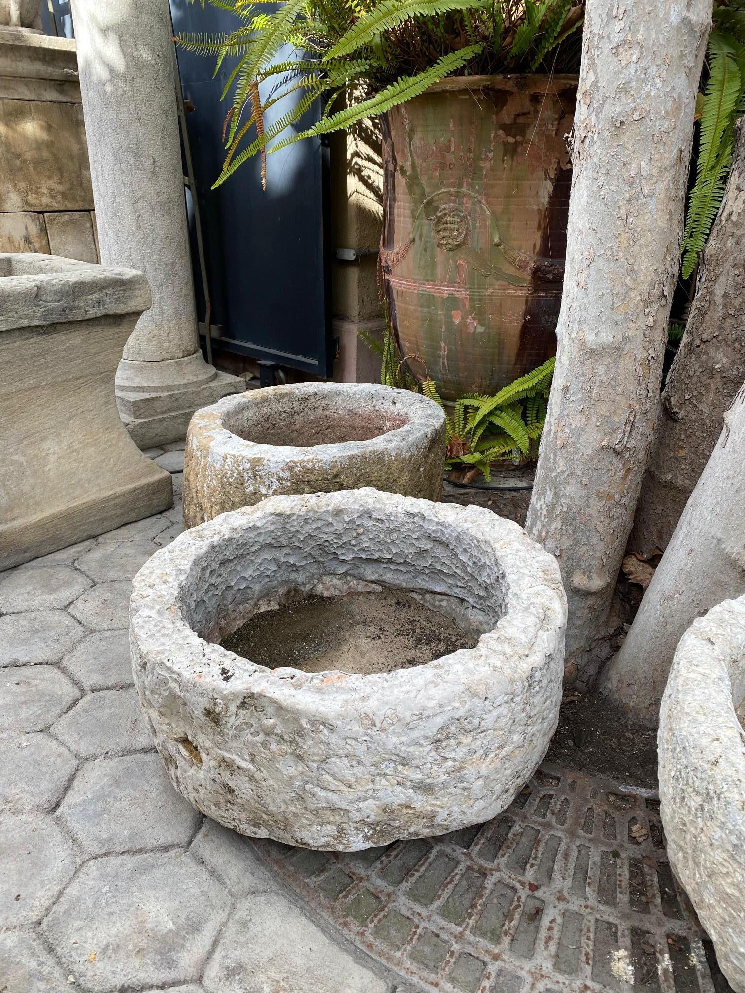 A beautiful 18th / 19th century hand carved stone container basin having a nicely textured surface and patina. It could be standing alone as a decorative object or used as a planter indoor outdoor. This Antique Stone vessel mortar planter has a lot