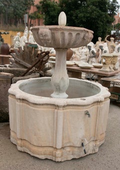 Hand-Carved Stone Fountain with a Plate Decorated with Faces