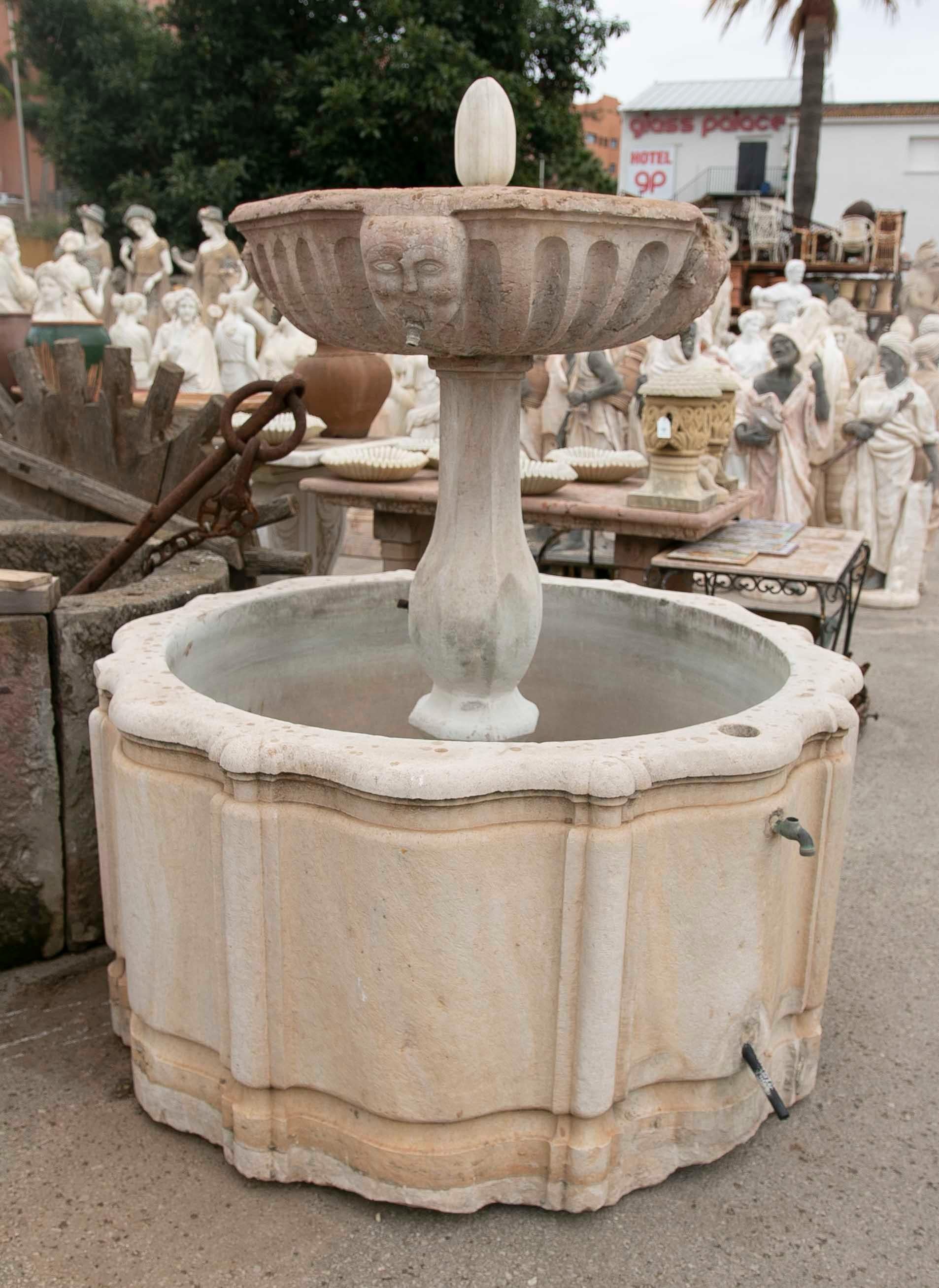 Spanish Hand-Carved Stone Fountain with a Plate Decorated with Faces For Sale