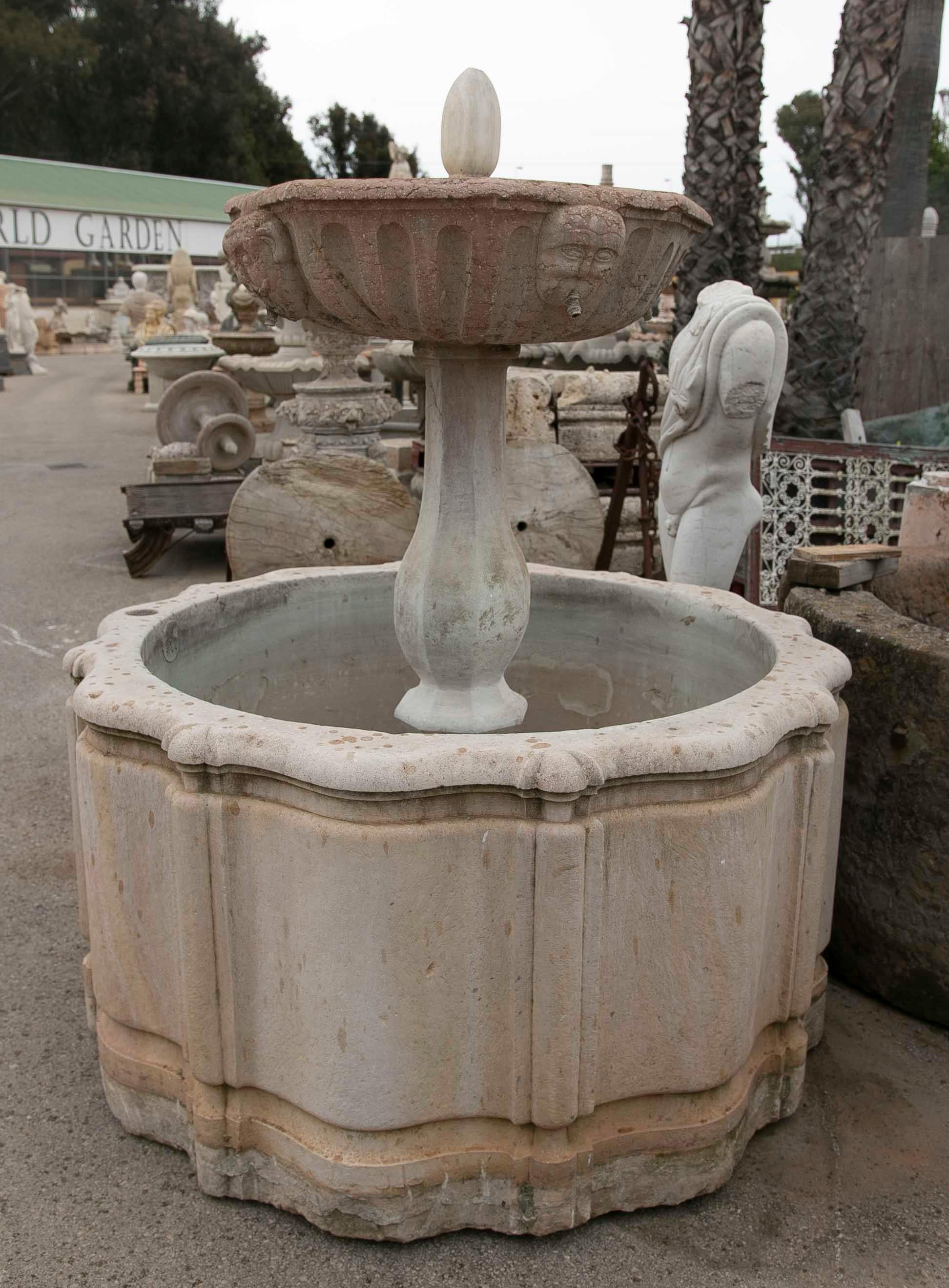 18th Century and Earlier Hand-Carved Stone Fountain with a Plate Decorated with Faces For Sale