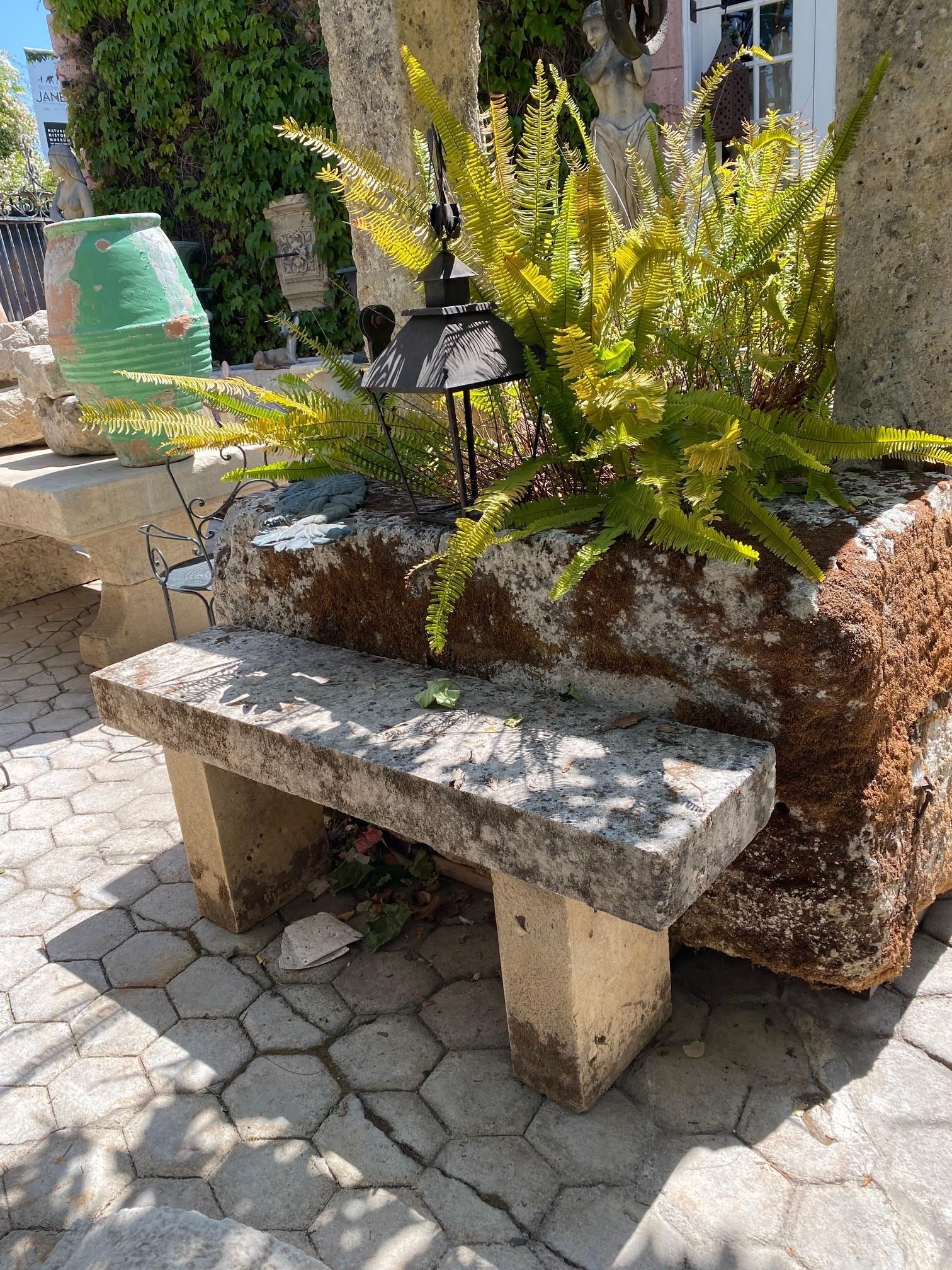 19th Century hand carved large stone garden bench 4 ¾” thick stone top slab. This beautiful high Seat is garden bench with simple lines that works in an interior as a seat or decorative architectural sculpted element . Mounted against a wall in a