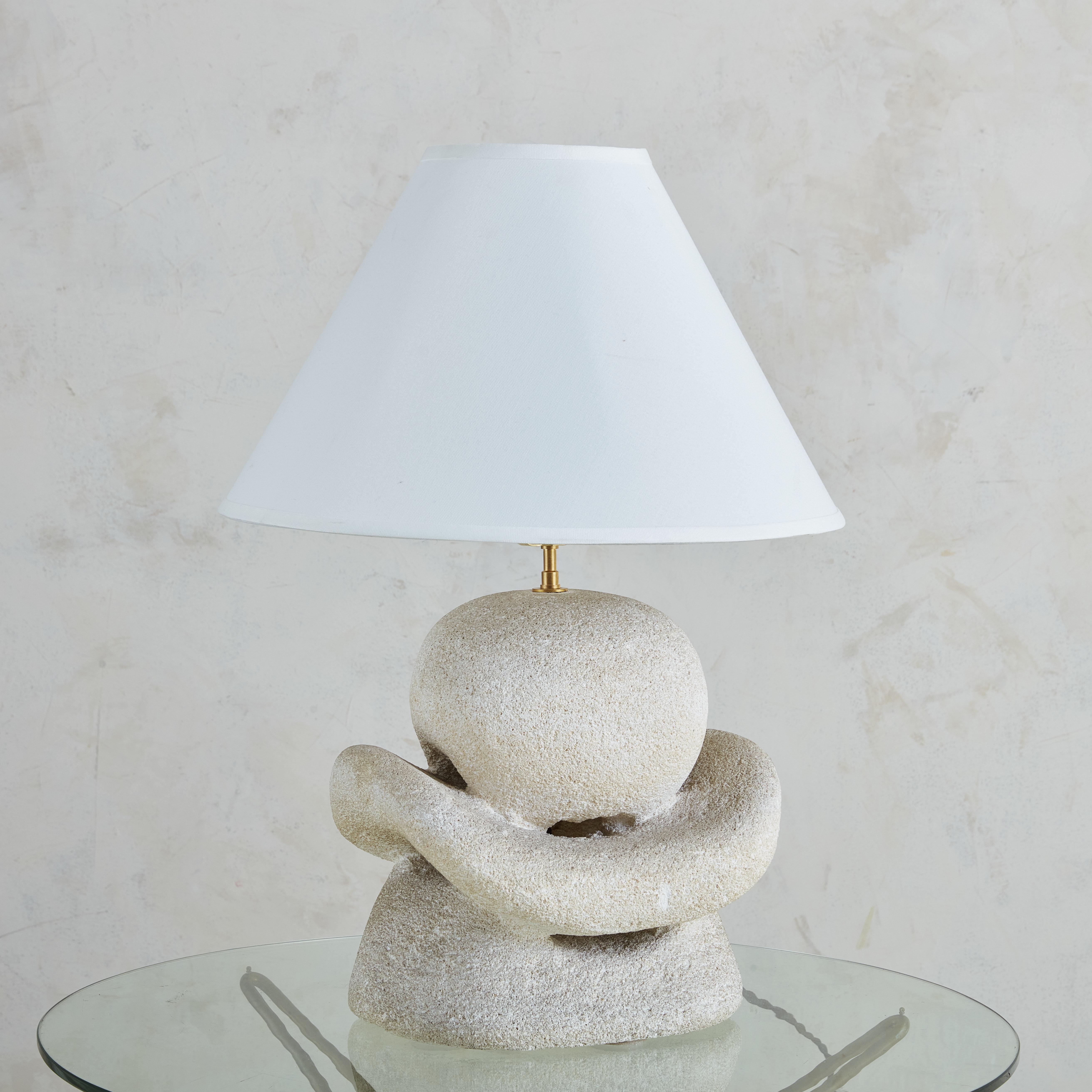 Hand-carved solid limestone table lamp by Albert Tormos, France, circa 1970s. Beautifully carved this 3d abstract and organic sculpture showcases sinous lines and a hammered finish.

Albert Tormos was a French artist who developed lamps which he