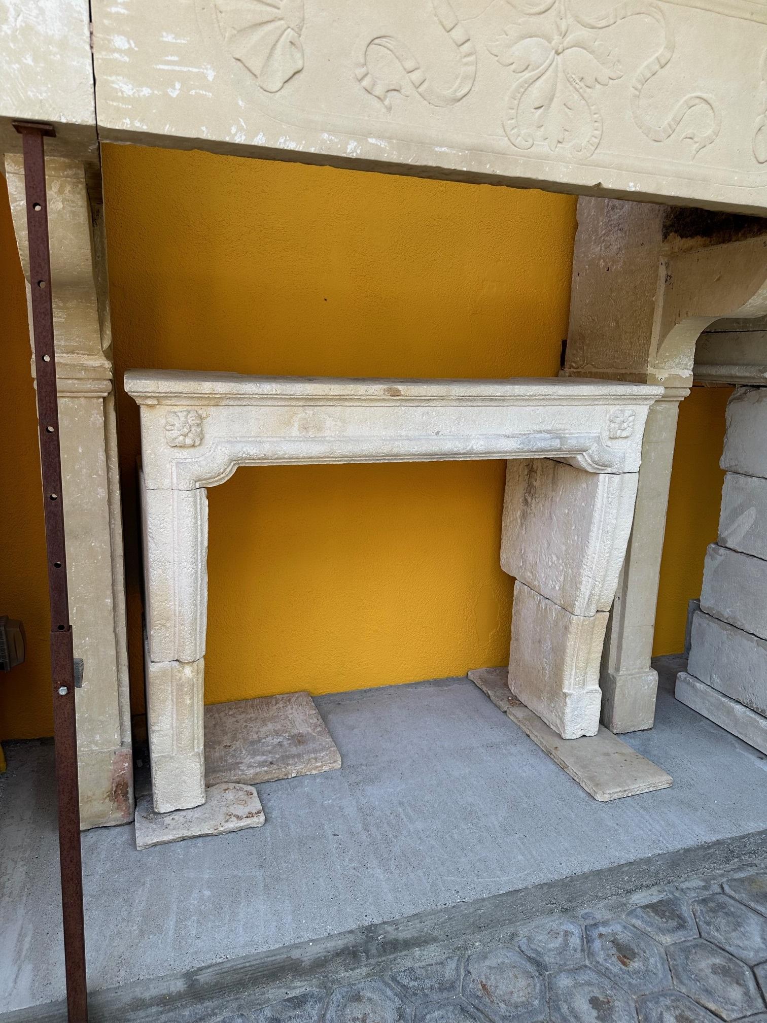 Hand Carved Stone Limestone Simple Rustic Fireplace Mantle Surround Antiques CA. A nicely Hand finished carved simple white and off white limestone fireplace mantel (fireplace) surround in the style of Louis XVI with a beautiful sculpted rosette on