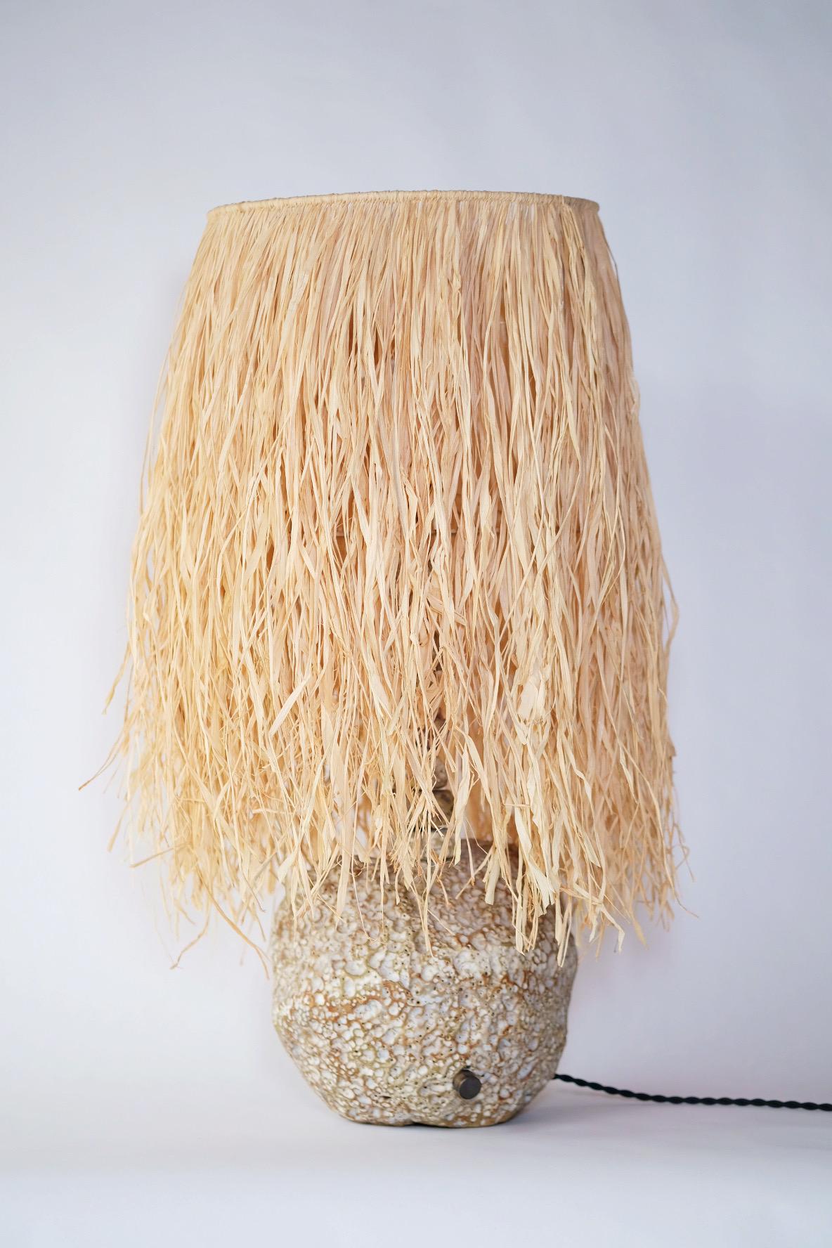 Hand-Carved Hand Carved Stoneware Pacific Table Lamp with Raffia Shade by LGS Studio For Sale