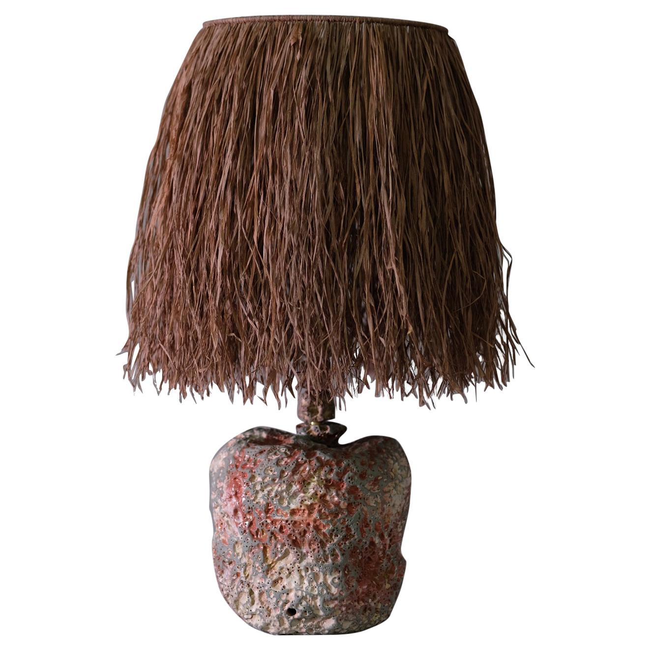Hand Carved Stoneware Pacific Table Lamp with Raffia Shade by LGS Studio