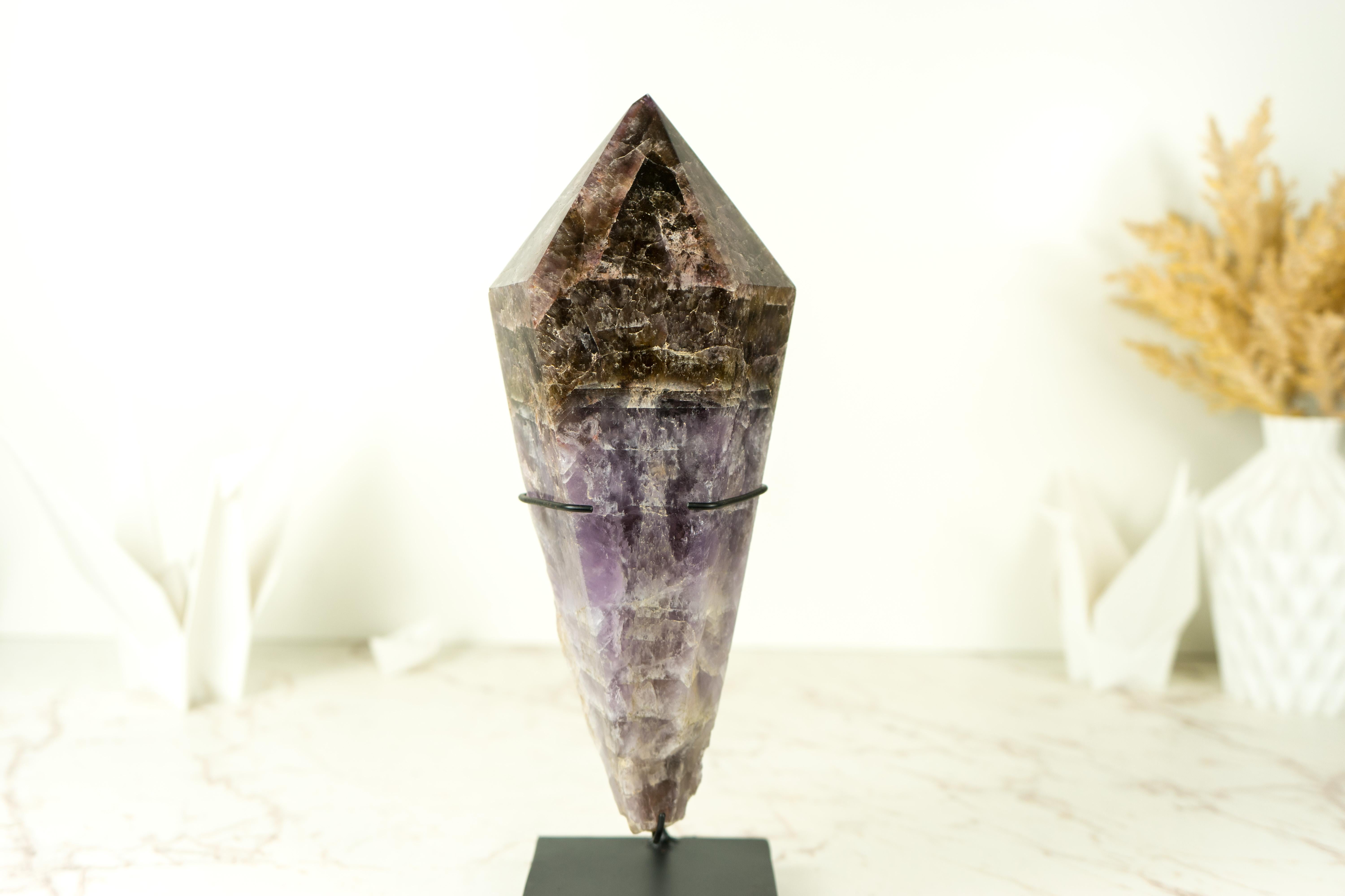 A Large and Long Super Seven Scepter Generator, this self-standing point is a remarkable specimen that showcases both impressive size and unique characteristics. This Super 7 crystal brings beautiful colors on a X-Large point and it's not only a