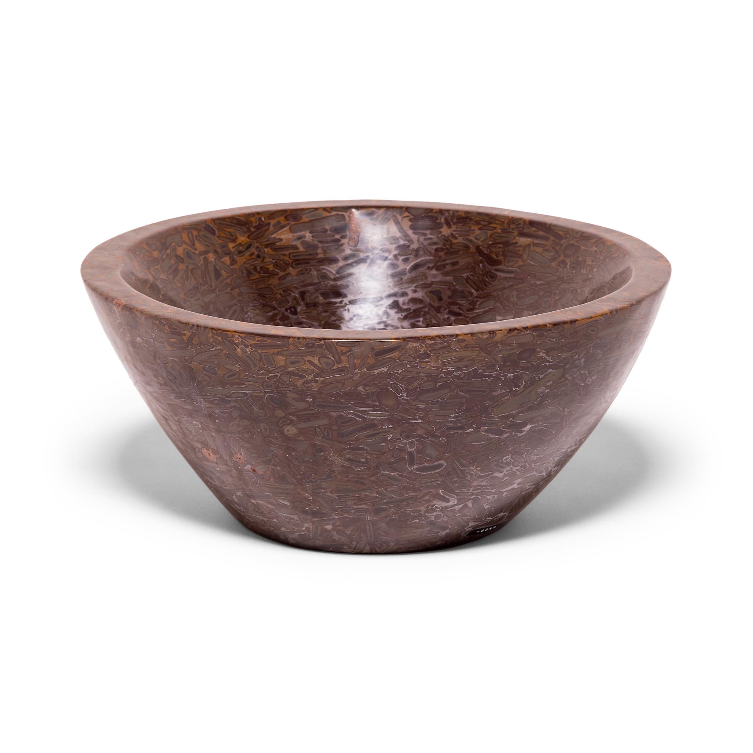 A clean-lined interpretation of an ancient form, this tapered basin was hand-carved by artisans in China's Shandong province. Though it looks like a meticulous painting, the mesmerizing pattern of the puddingstone is actually inherent to the stone,