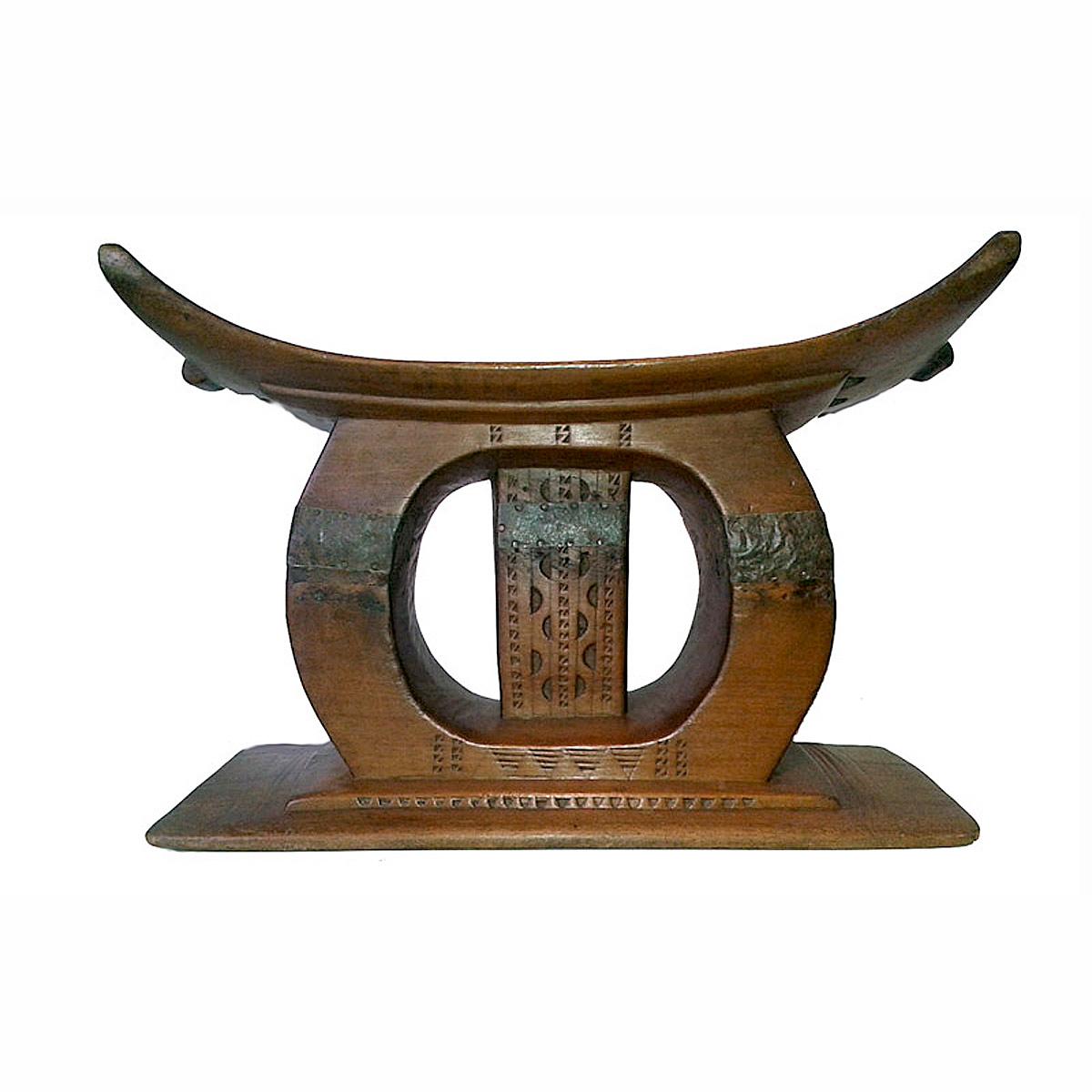 An Ashanti stool, traditional personal stool from Ghana. Mid 1970s. 
Hand-carved from a single piece of teak wood. 

Use as a low end table, stand or seat.