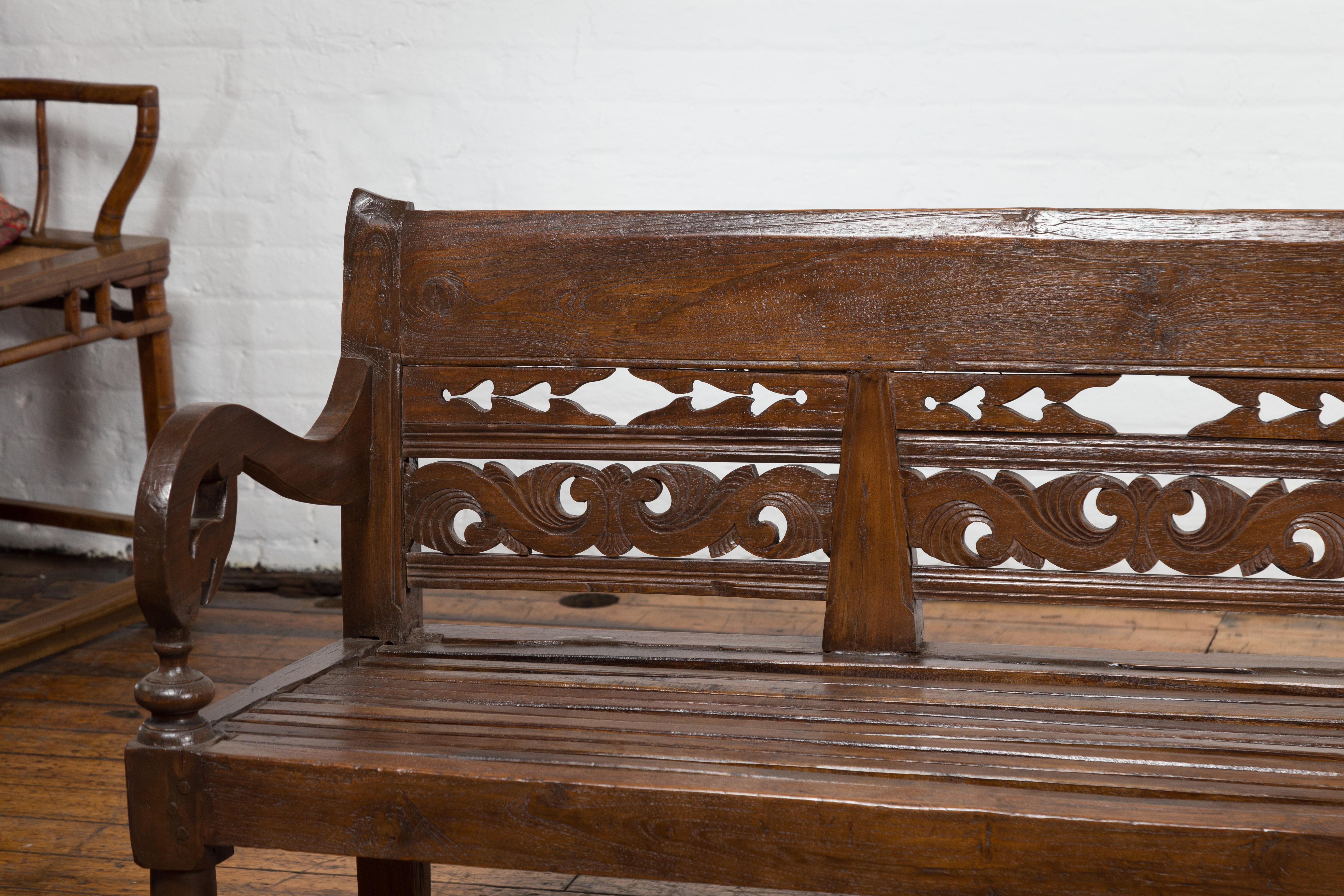 Javanese Hand Carved Teak Wood Settee with Scrolling Foliage and Turned Legs