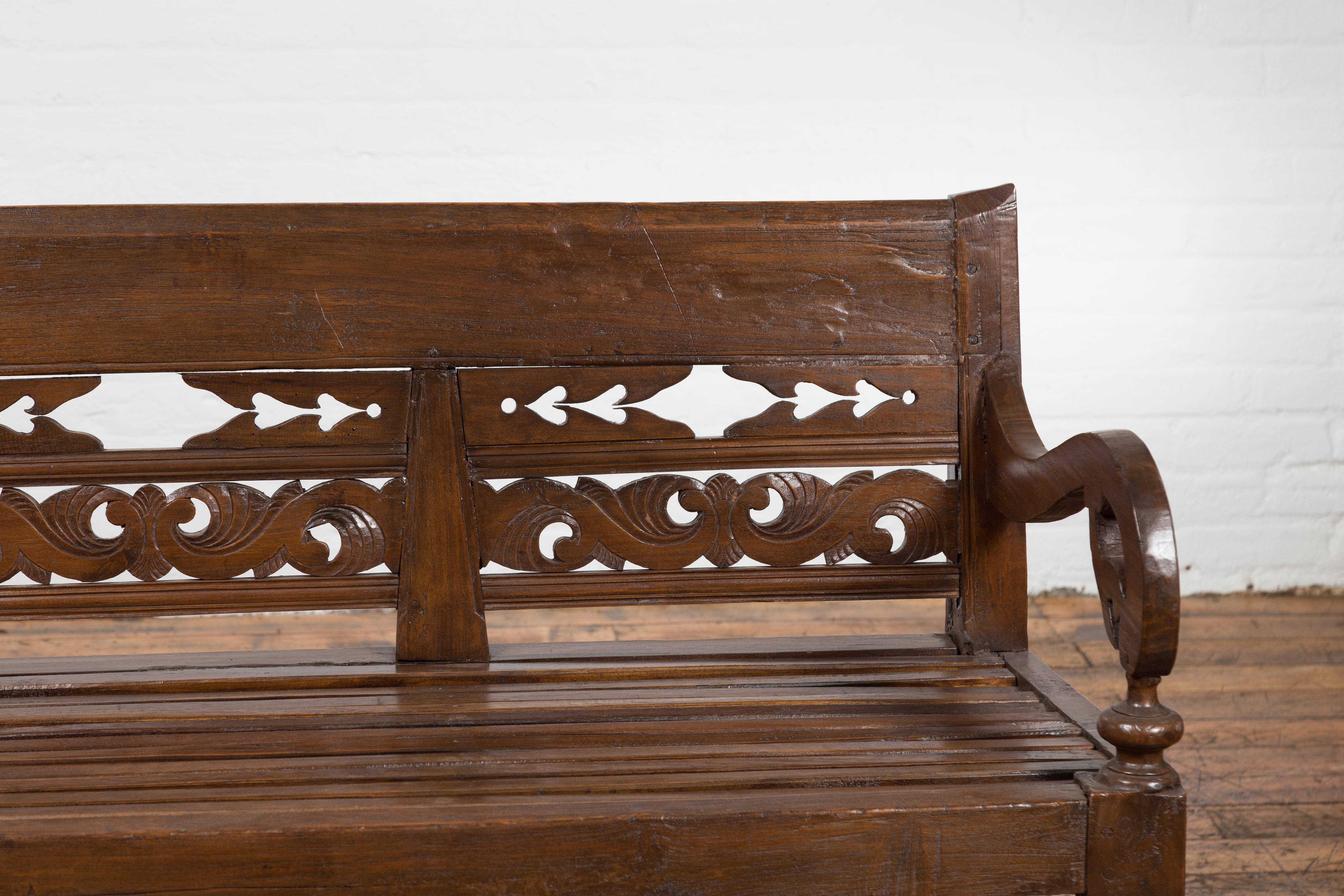 Hand Carved Teak Wood Settee with Scrolling Foliage and Turned Legs In Good Condition In Yonkers, NY