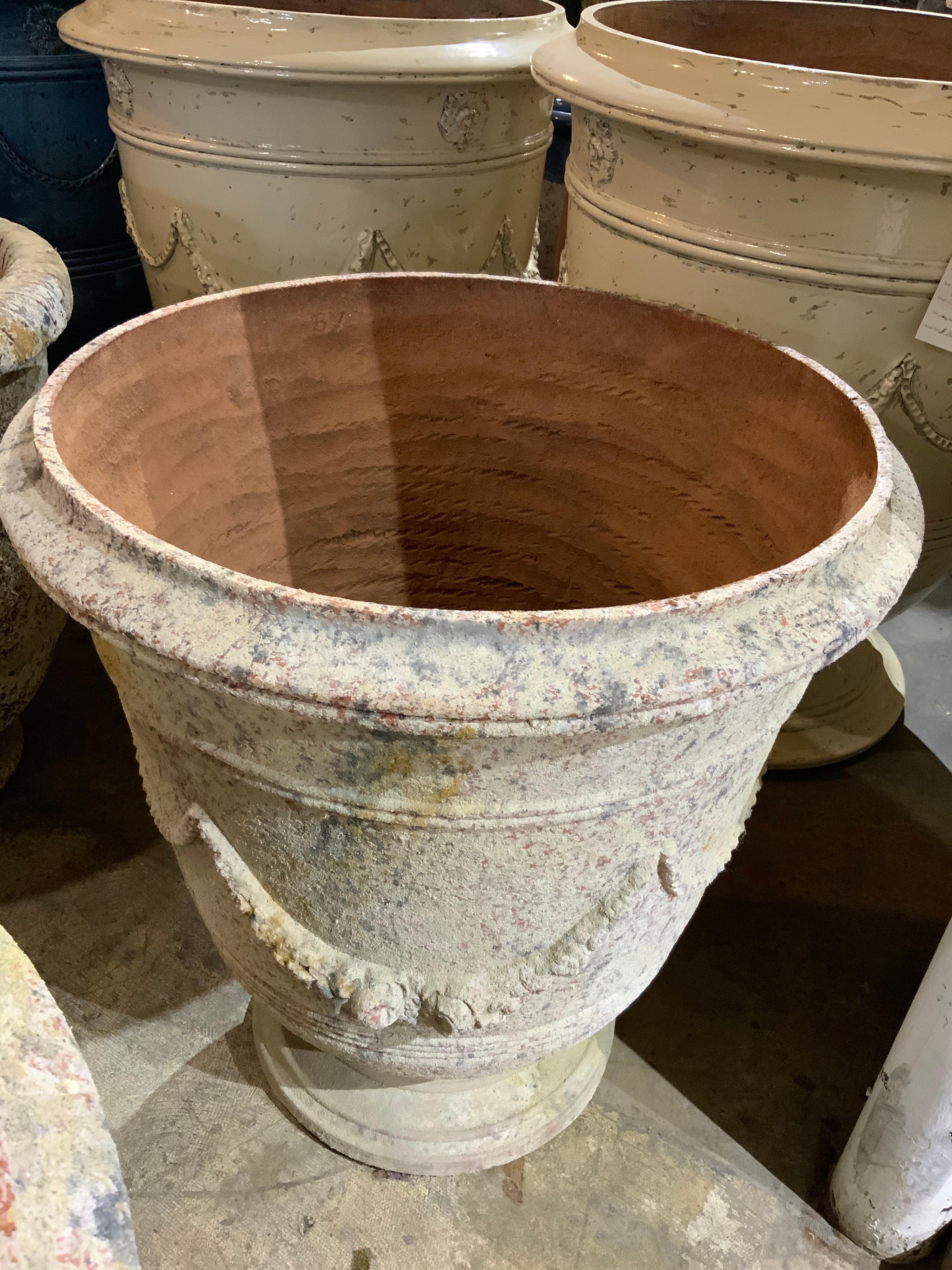 This hand carved terracotta urn origins from Provence in France.
  