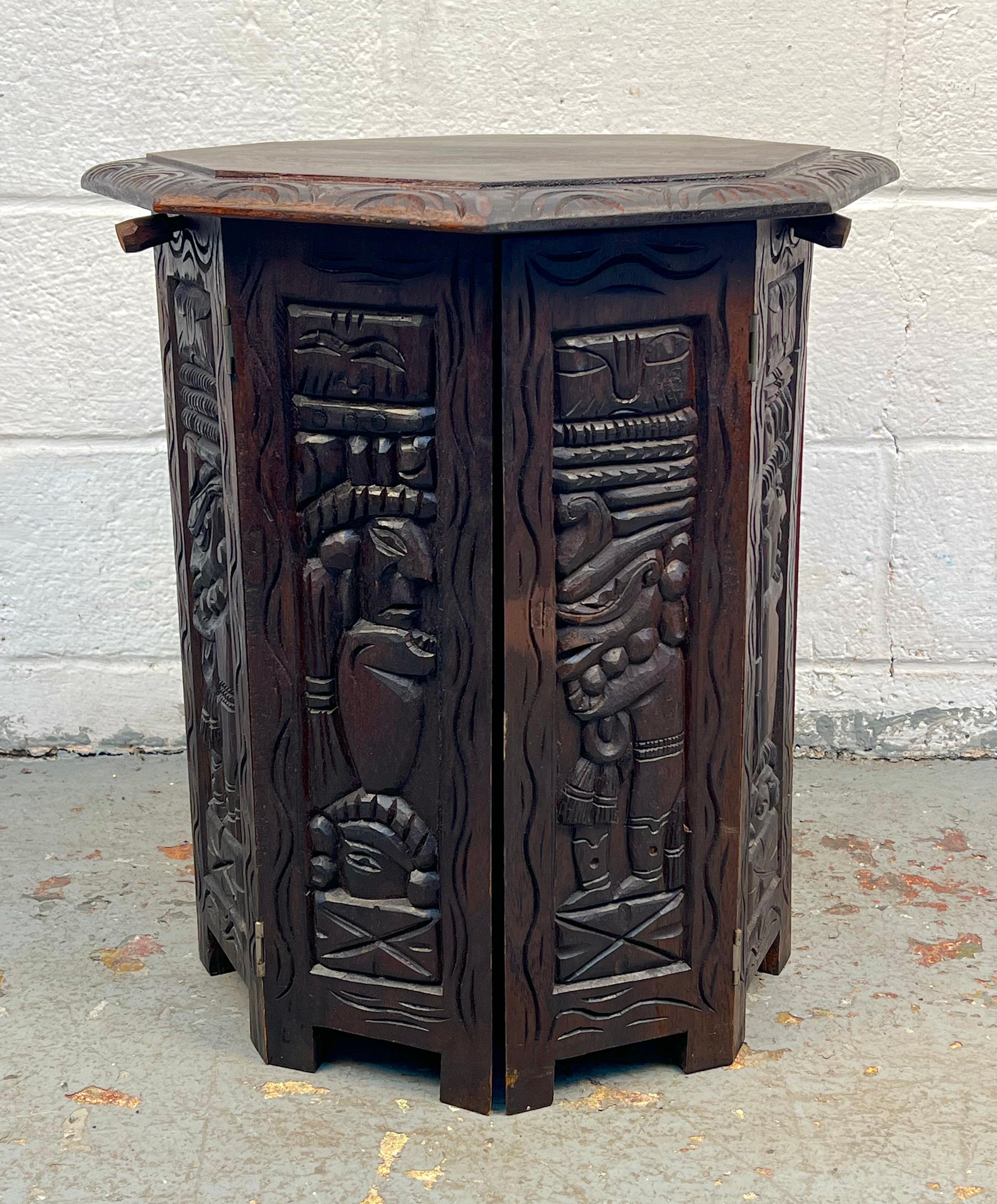 This 60s tribal side table would be a beautiful and subtle addition to any living room. The unique, hand-carved designs on the sides and along the edge of the top are quite pleasant to look at. The piece, overall, is small but thought-provoking, and