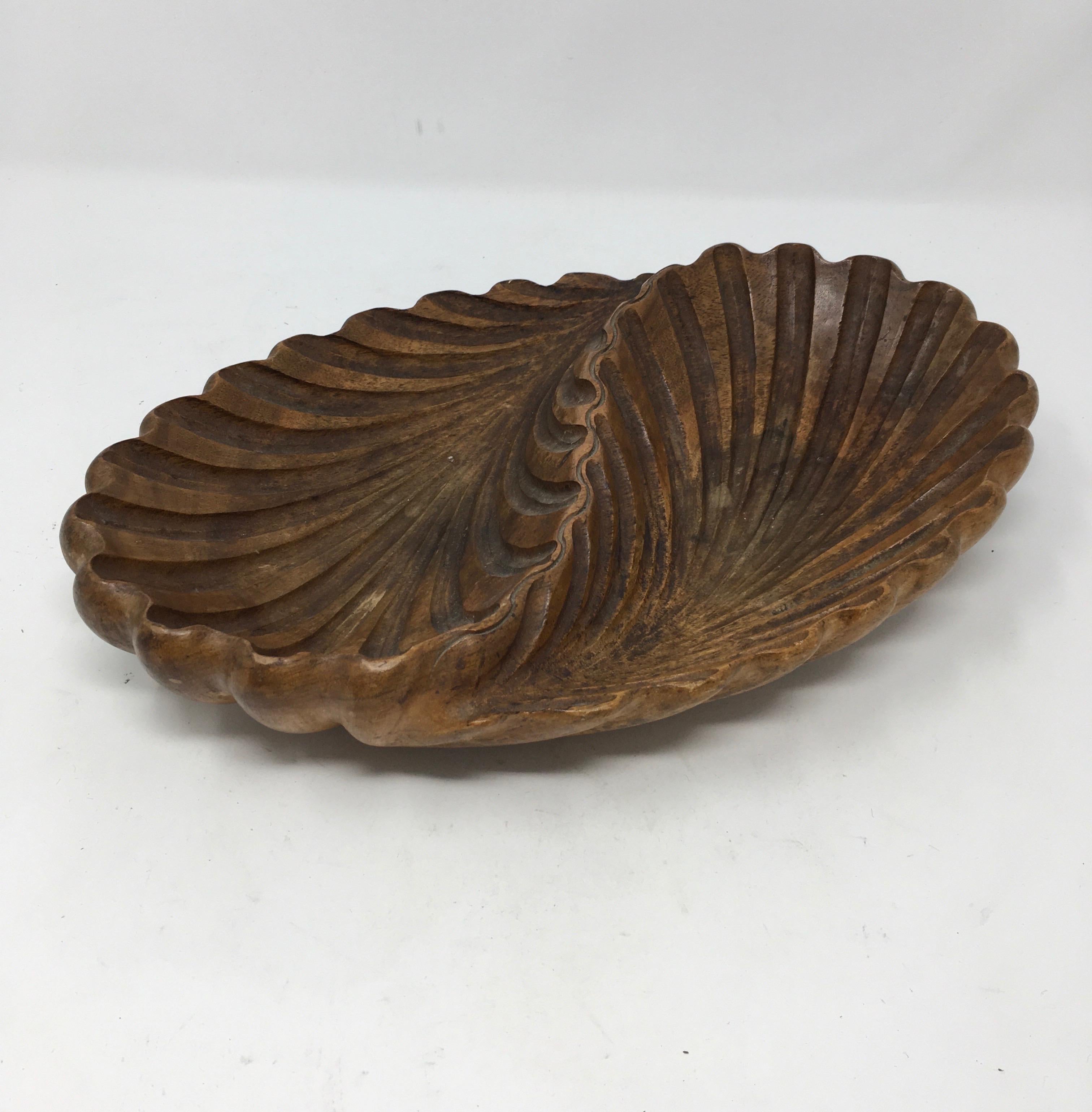 Found in France, this is a beautiful hand carved two leaf bowl. The piece is hand carved out of wonderfully patinated walnut and is signed on the bottom.