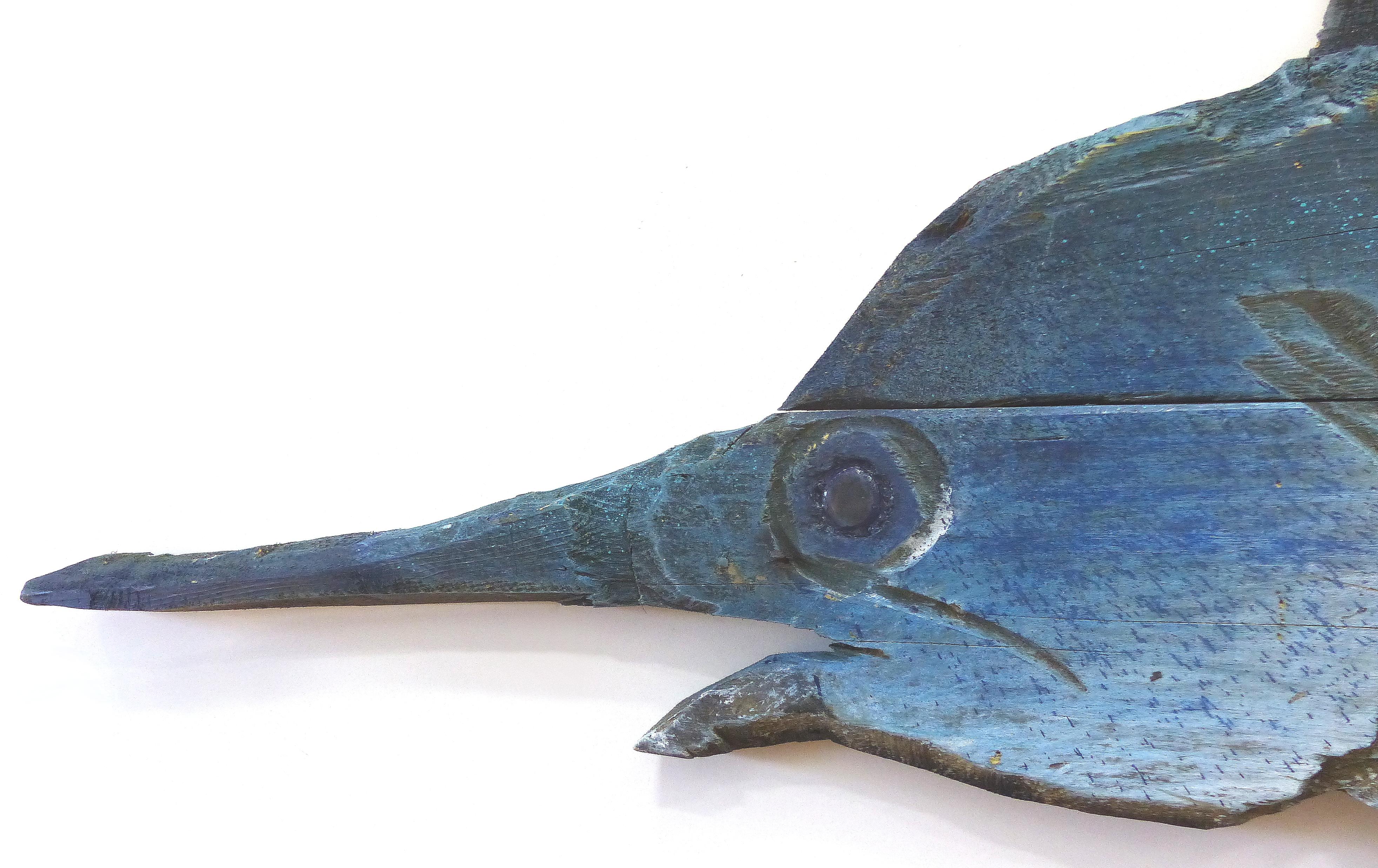 Offered for sale is a large life-size hand carved wall sculpture of a blue marlin by artist Davis Murphy. Murphy has created a body of work using some of the most beautiful hardwoods found in America's forests. His most recent body of work captures