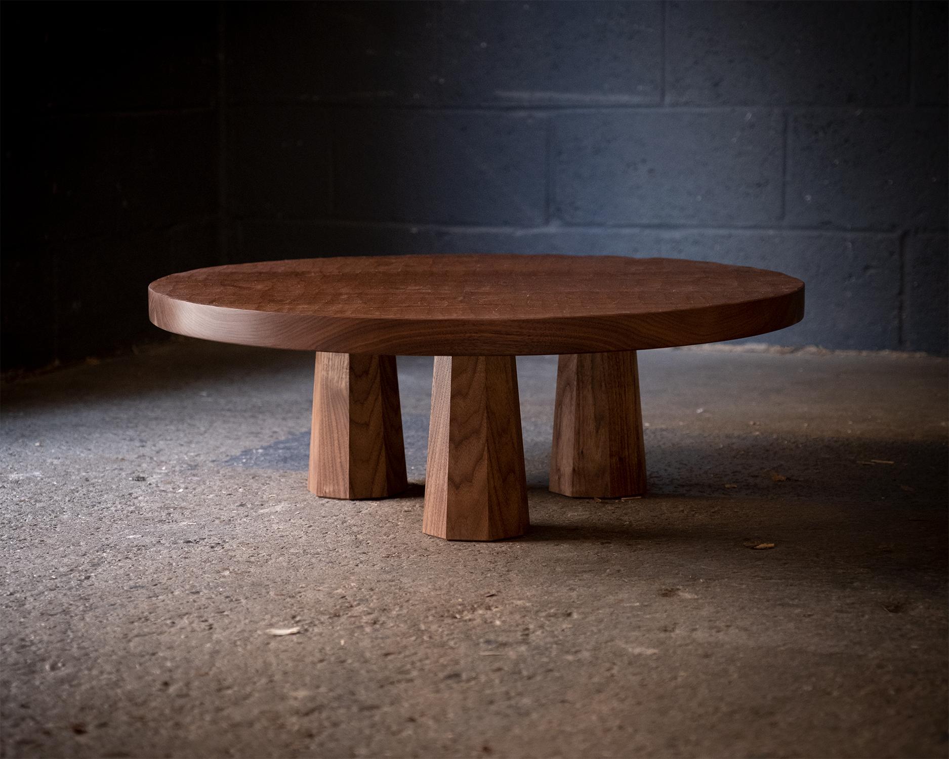 Made of premium-grade walnut, or a variety of other timber options, the piece features a prominent hand-carved texture across the top surface. The natural beauty of the timber is a key feature. Made of solid construction and sturdy legs, it is built