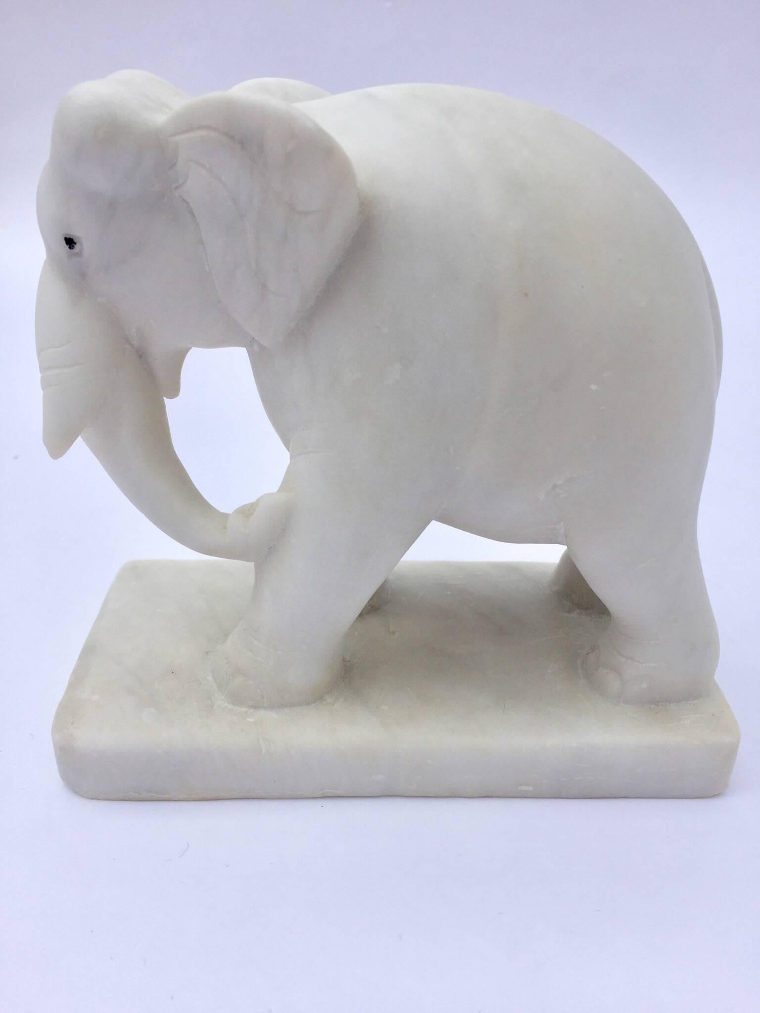 Elegant sculpture that show an elephant carved in white marble presented on a stand.
The representation of elephant in Asia represent wisdom, longevity and white marble is for peace.
Hand-carved white marble elephant on stand from Jaipur,