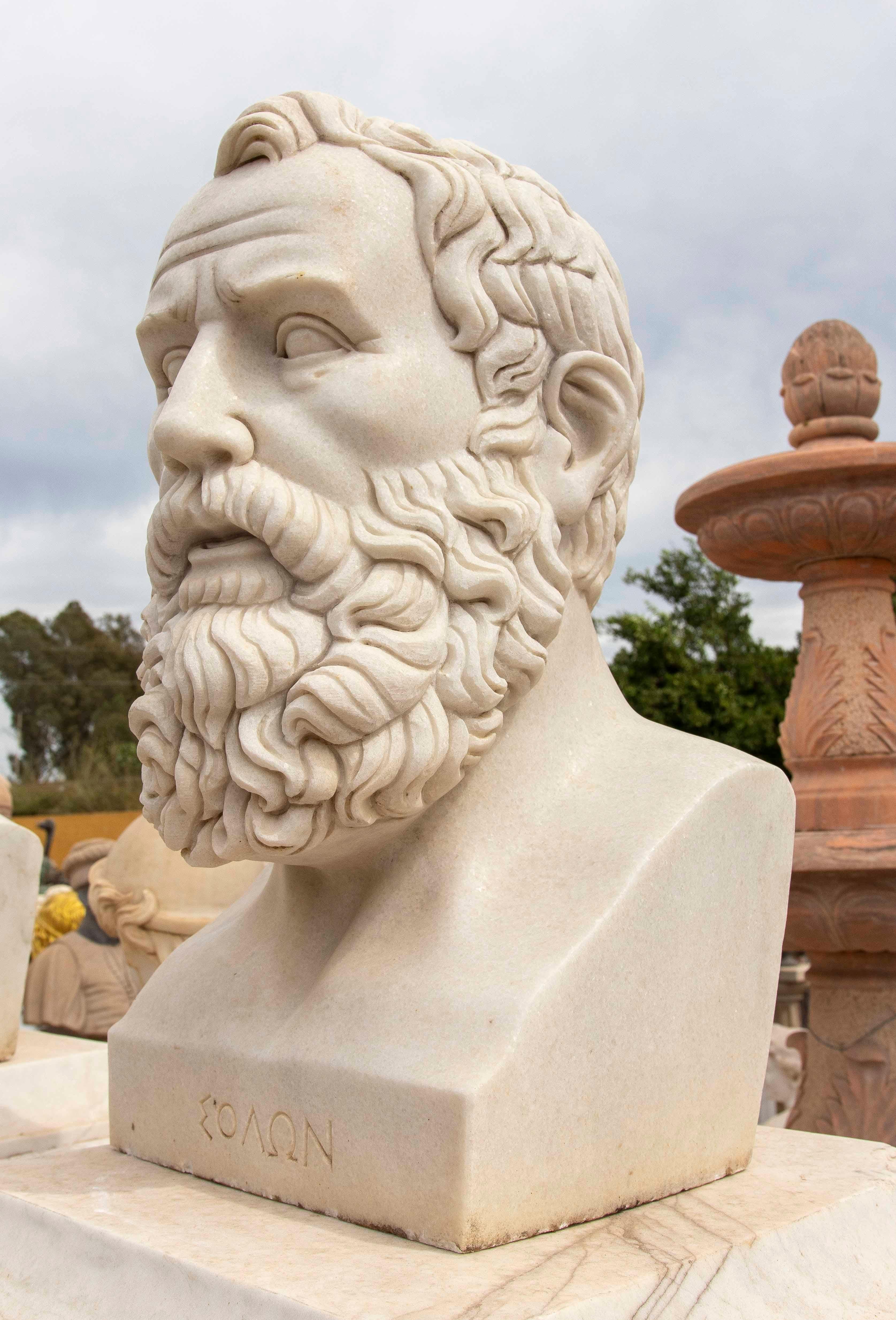 Exceptional bust carved in white marble depicting Solon, the famous Athenian legislator and poet considered one of the Seven Sages of Greece. The sculptor has captured in detail the serenity of his countenance and the density of his curly beard,