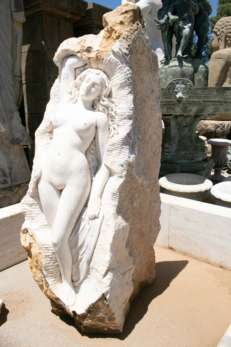 Hand carve white marble female sculpture on a single block.