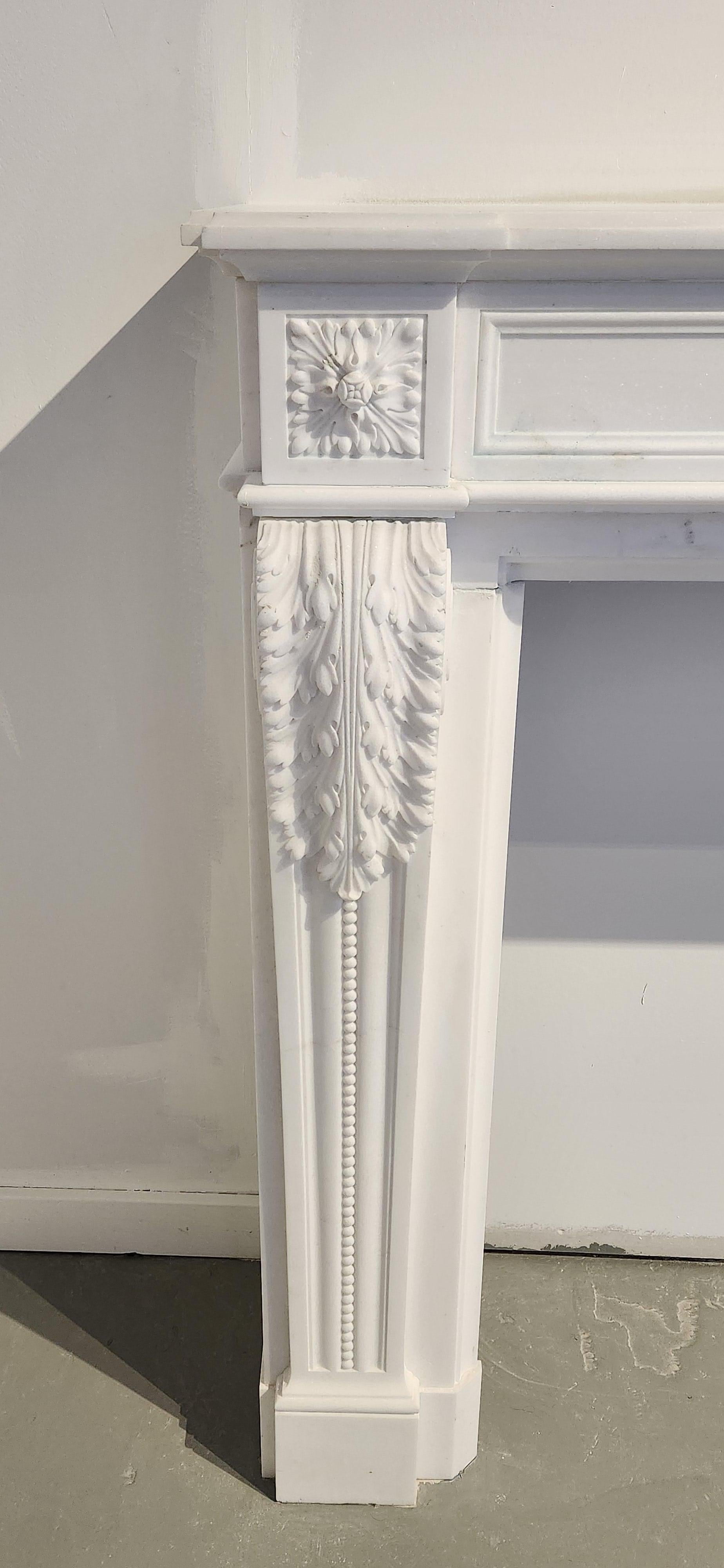Unknown Hand-Carved White Marble Fireplace Mantel in the Regency Style For Sale