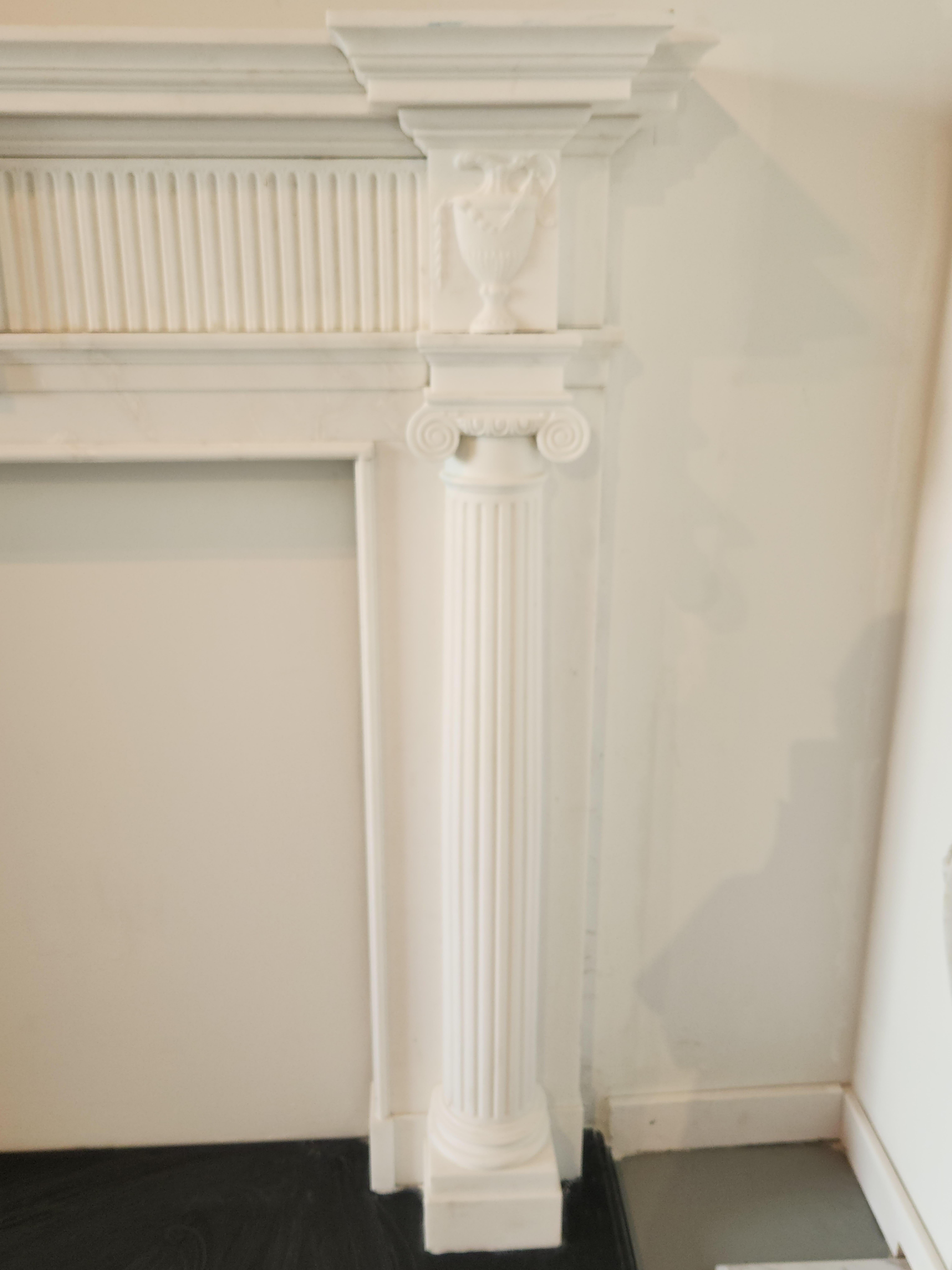 Unknown Hand-Carved White Marble Fireplace Mantel with Fluting in the Regency Style For Sale