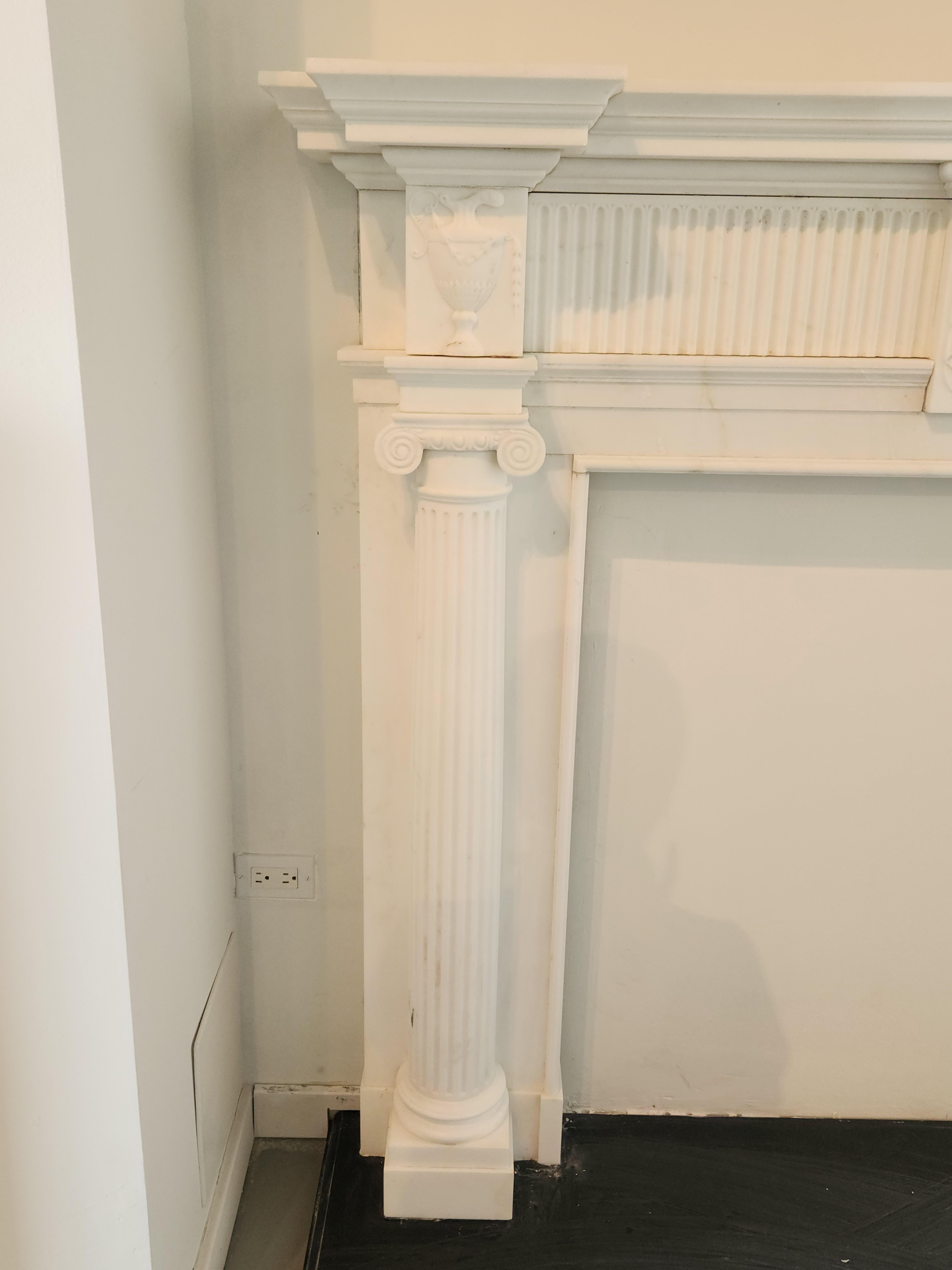 Hand-Carved White Marble Fireplace Mantel with Fluting in the Regency Style In Good Condition For Sale In Chicago, IL