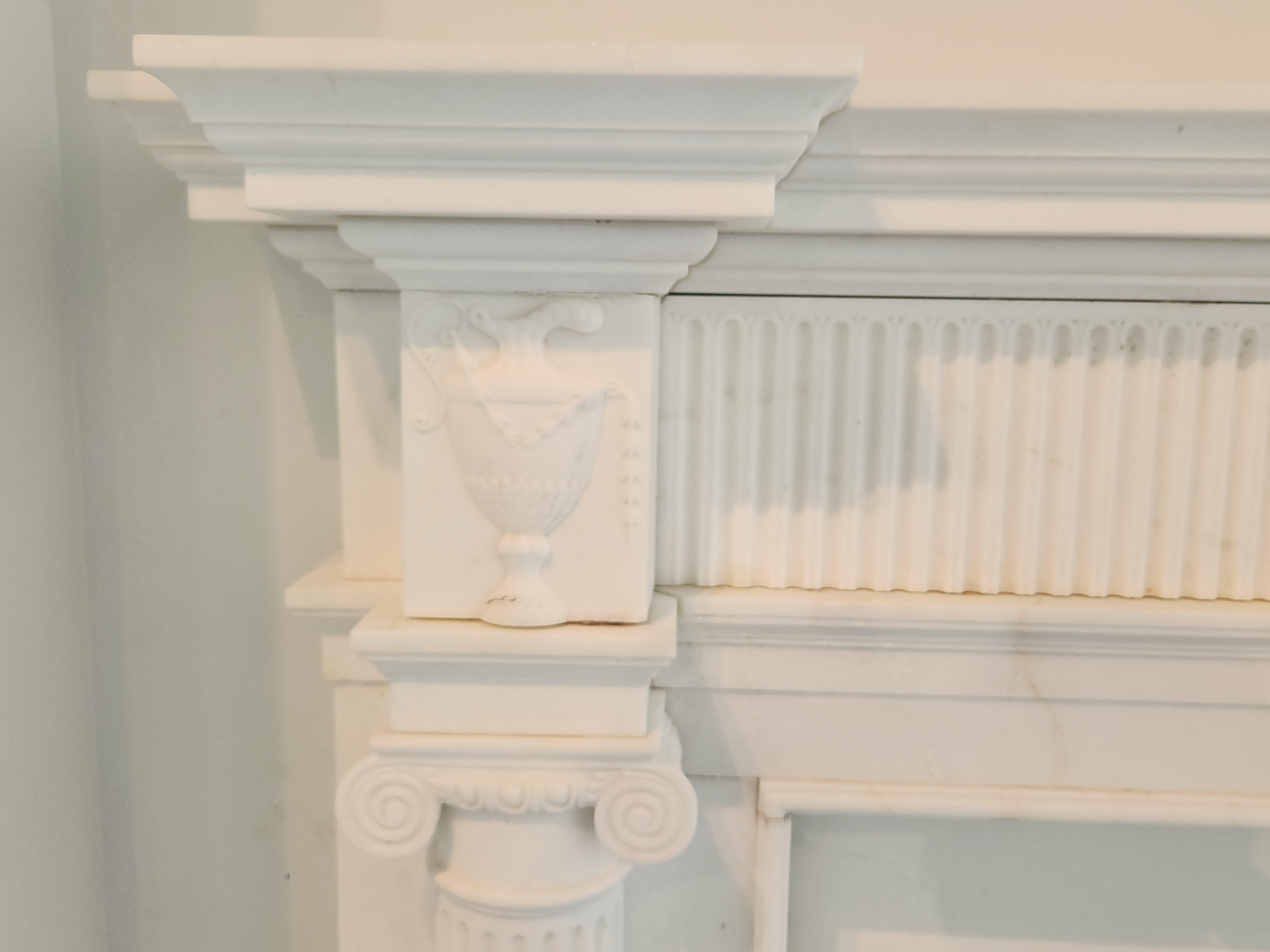 Contemporary Hand-Carved White Marble Fireplace Mantel with Fluting in the Regency Style For Sale
