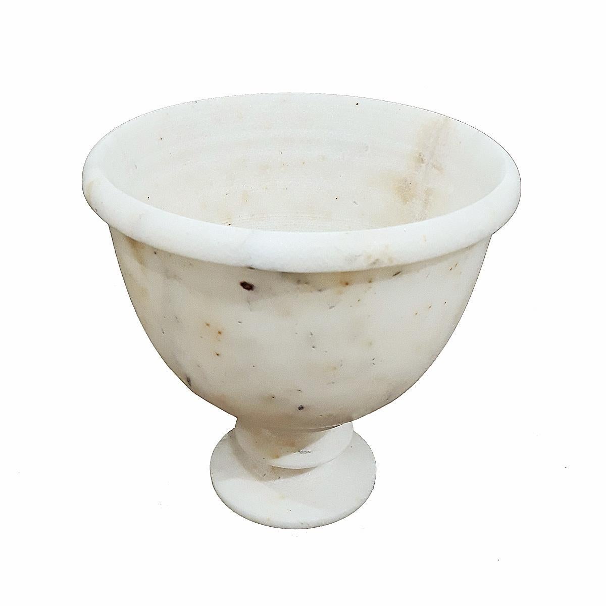 A hand-carved goblet in white marble from India, late 20th century. Naturally veined marble. 
As a bathroom / kitchen accessory, or as a decorative accent, this piece is both attractive and functional.
   