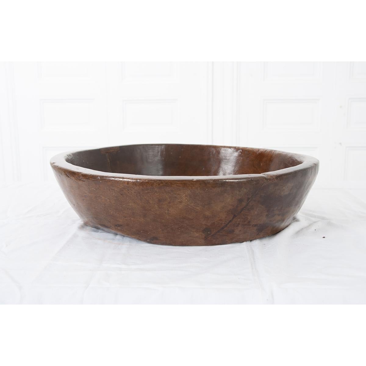 This is an English 19th century hand carved wood bowl - well used and beautiful. The sides and bottom are very thick. The bowl would look great on any table or kitchen island. Circa 1850.