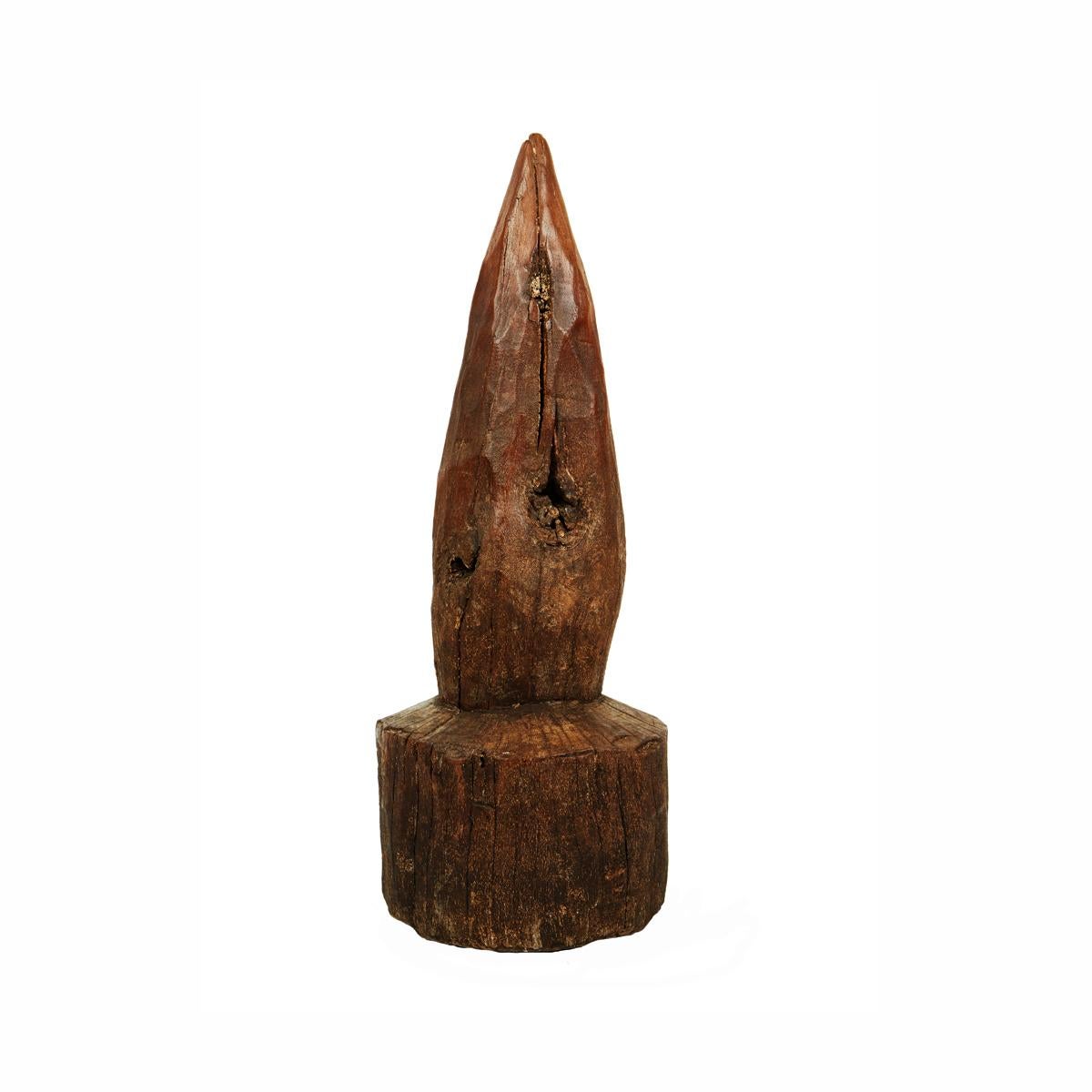 A single piece of solid mango wood, hand carved into a standing cone, circa 1960. Use it as door stoppers, or in a group for an eye-catching accent in any rustic or eclectic decor, indoors or outdoors. 

