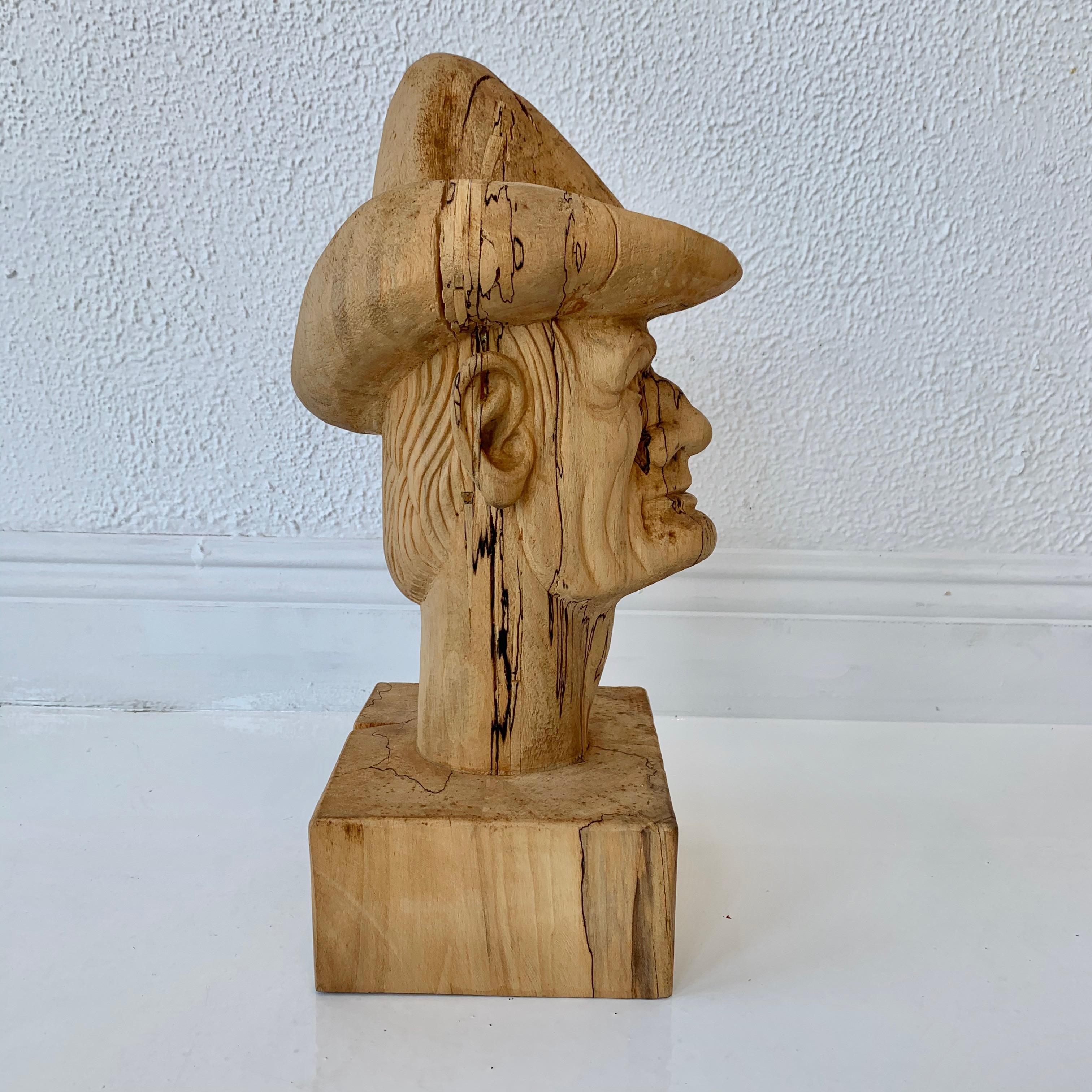 wooden cowboy statue