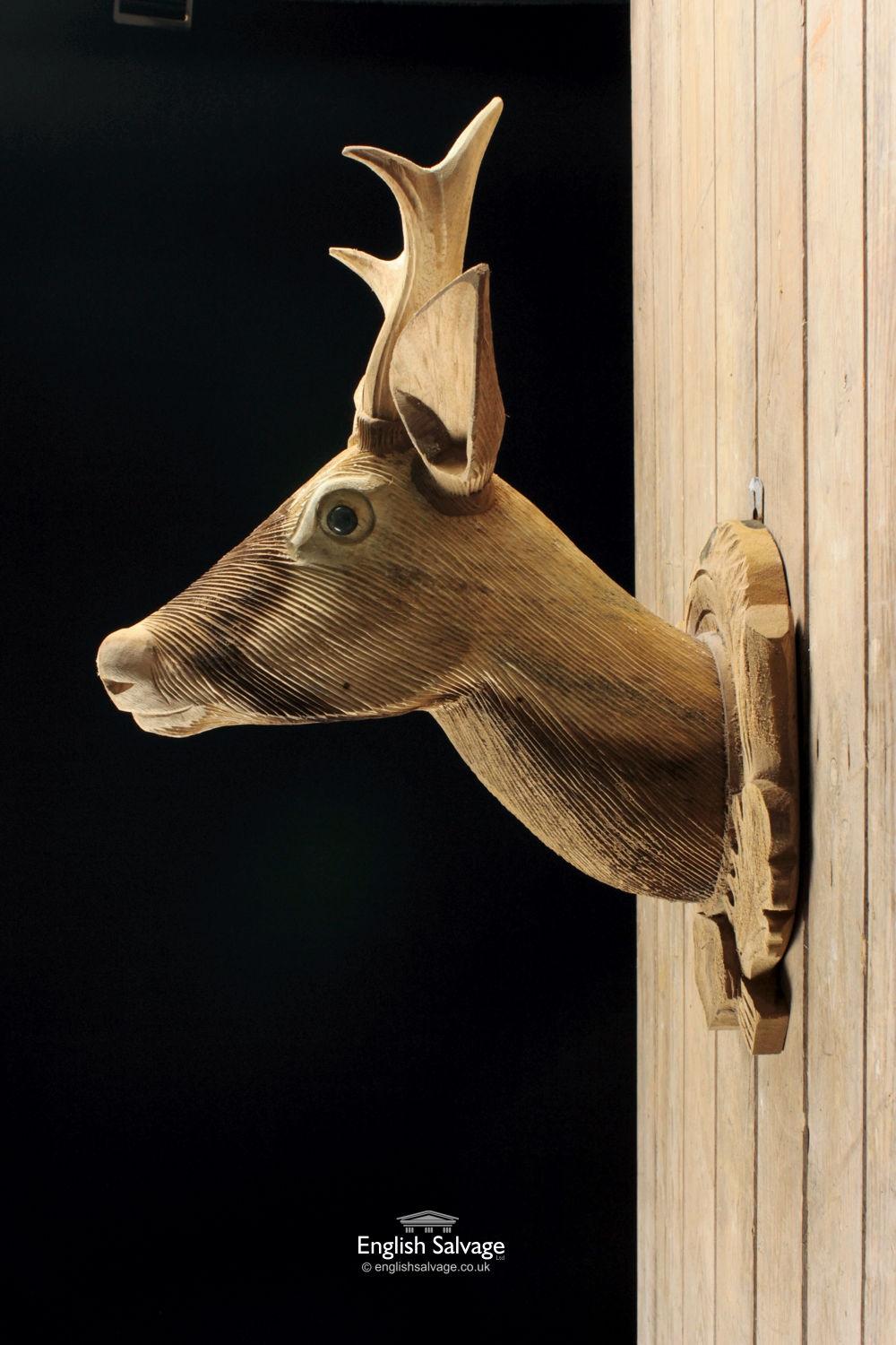 Hand carved wooden deer head, nicely detailed, suitable for wall hanging.