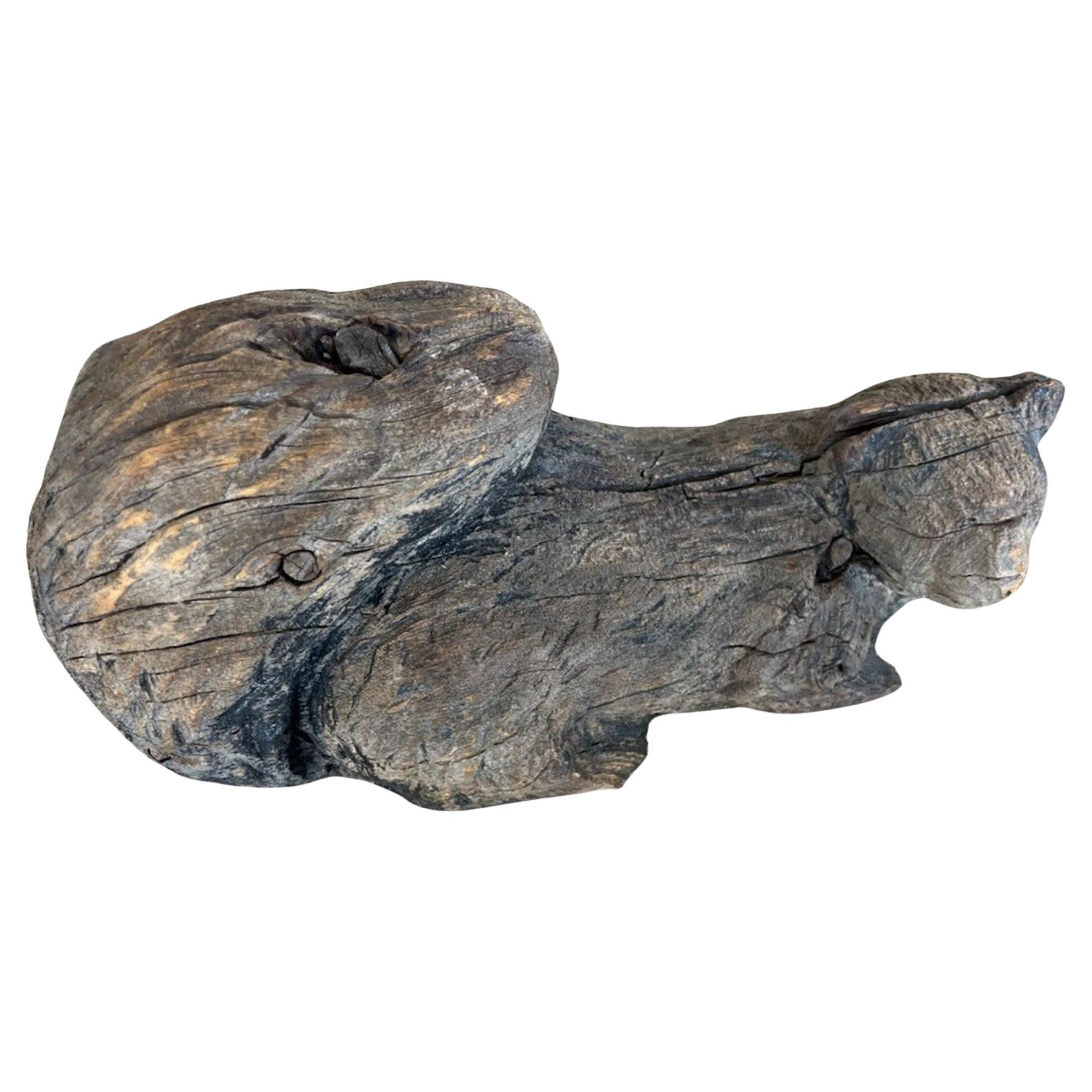 This folky hand carved  squirrel has fragments of paint but has a wonderful worn & aged patina.This hand carved guy was carved out of one piece of wood.