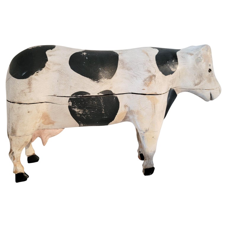 This fun folky hand carved & painted cow sculpture is in good condition with minor shrinkage cracks and some paint loss. This folky hand carved cow is such a fun toy.