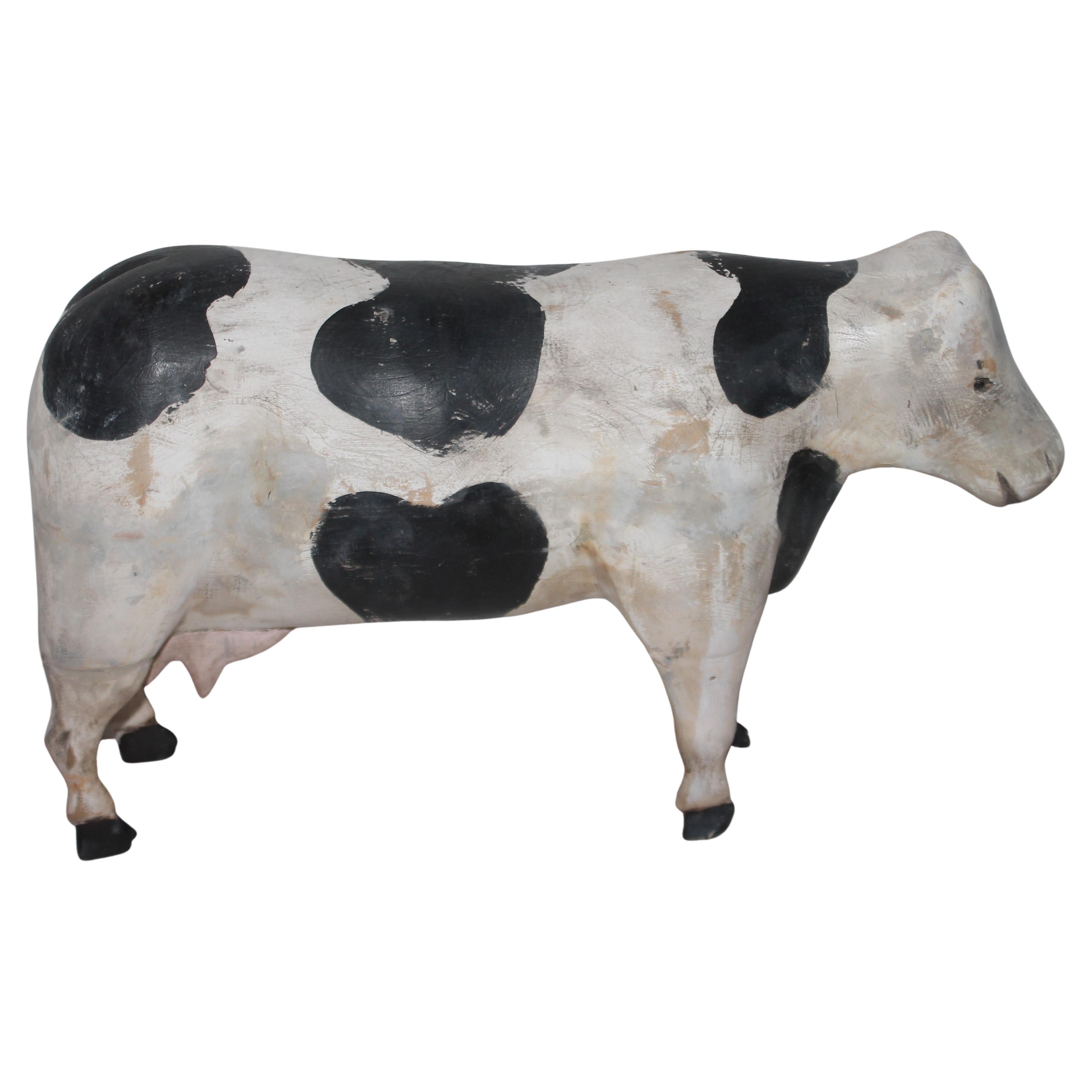 This fun folky hand carved & painted cow sculpture is in good condition with minor shrinkage cracks and some paint loss. This folky hand carved cow is such a fun toy.