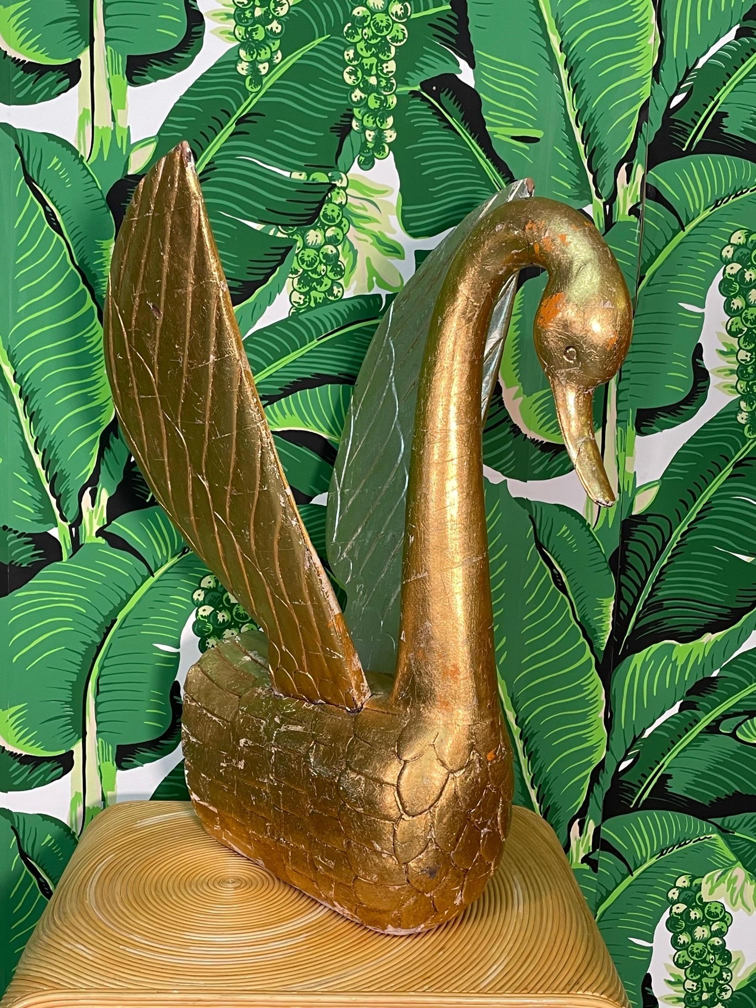 Large hand carved solid wood swan figurine with full gold leaf veneer. Intricate design and lovely patina. Good condition with imperfections consistent with age (see photos).