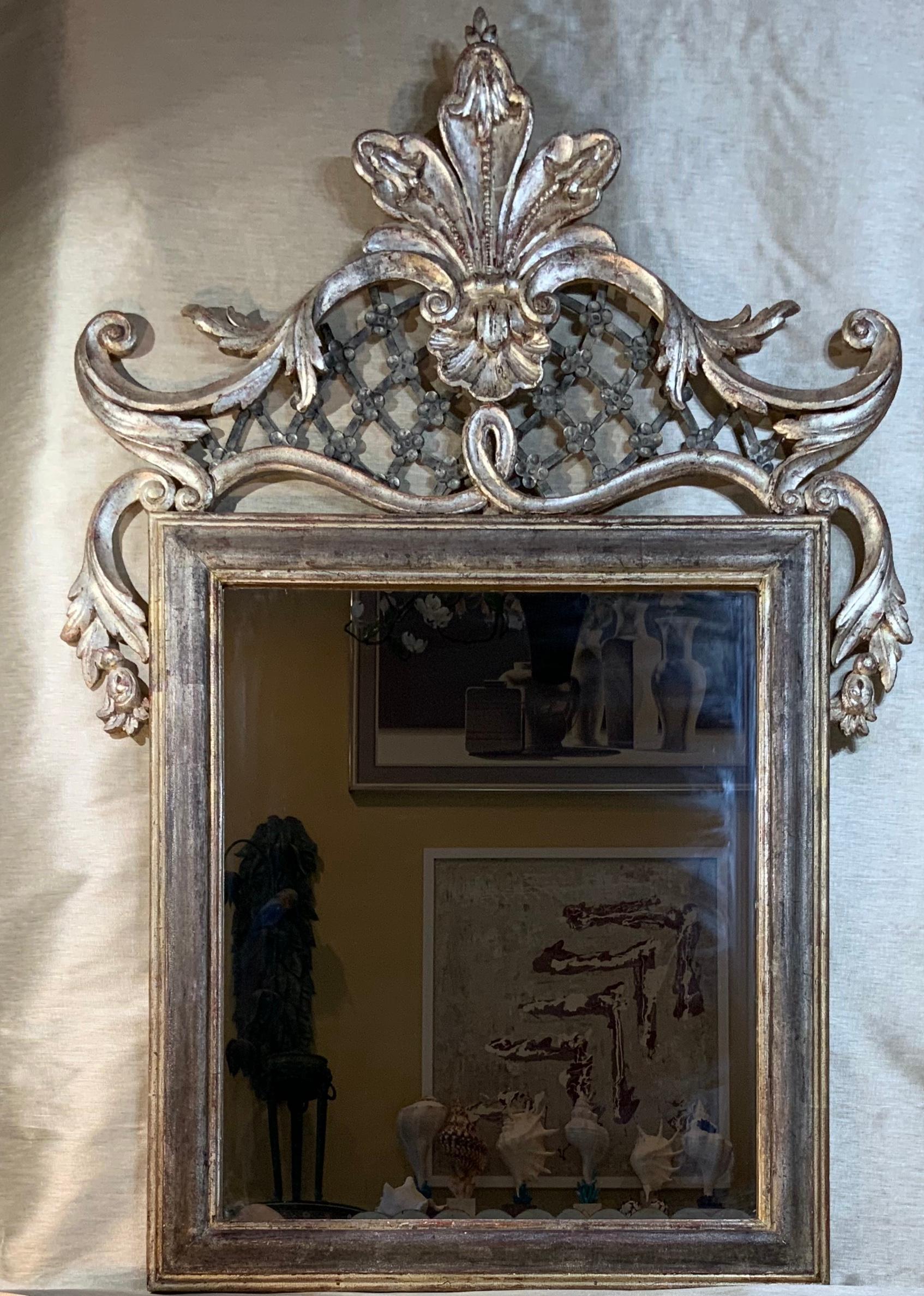 Beautiful antique hand carved wood Italian mirror with exceptional wrought iron decorative motifs.