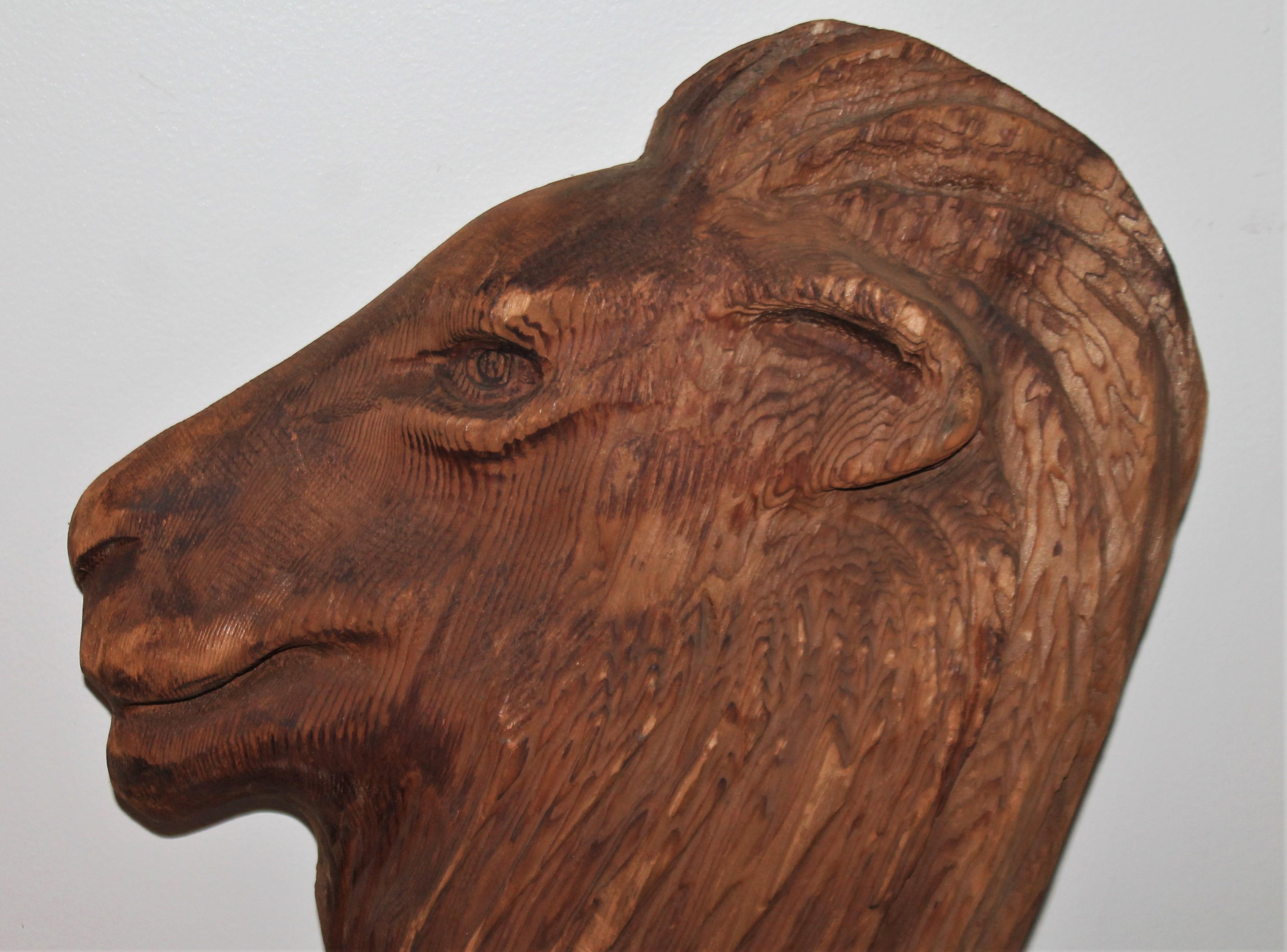 Early 20thc hand carved wood lion head from one solid piece of wood. Great form and proportional.