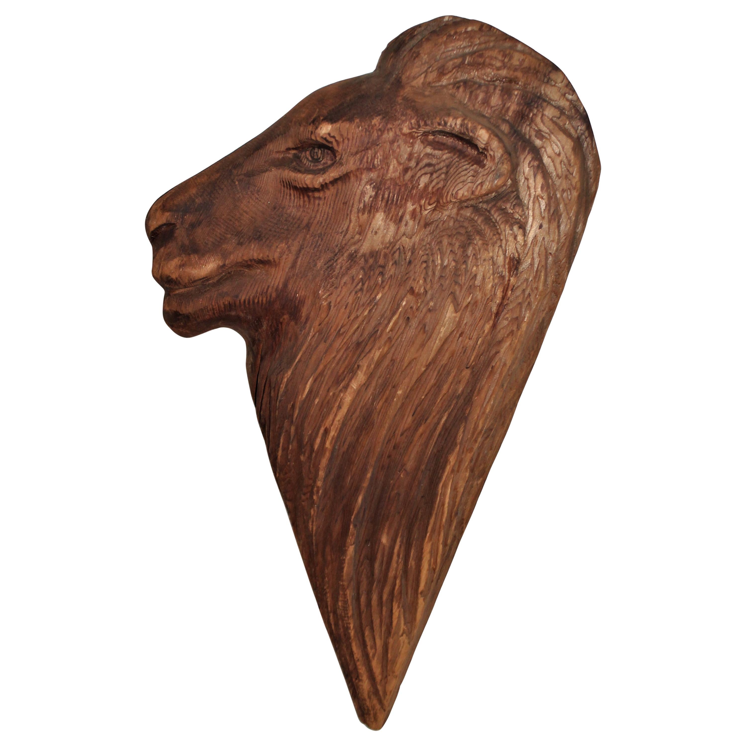 Tête de lion en bois sculpté à la main