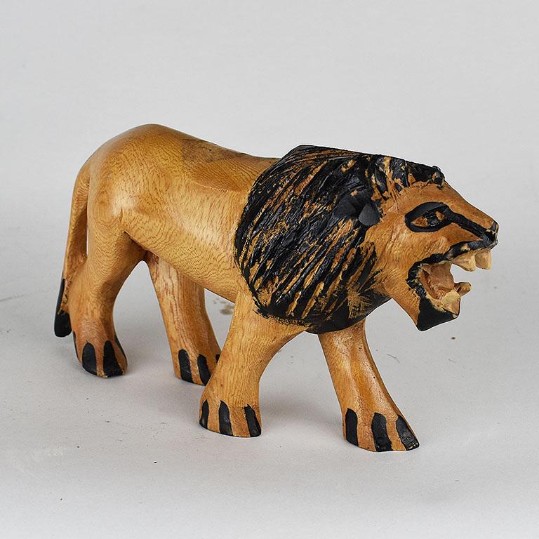 A whimsical hand carved lion statue from Africa. Hand carved by local artisans in East Africa in the 1970s, this wooden statue will be a great accent piece for any room. We especially love it for a nursery. (Or for someone who has the astrological