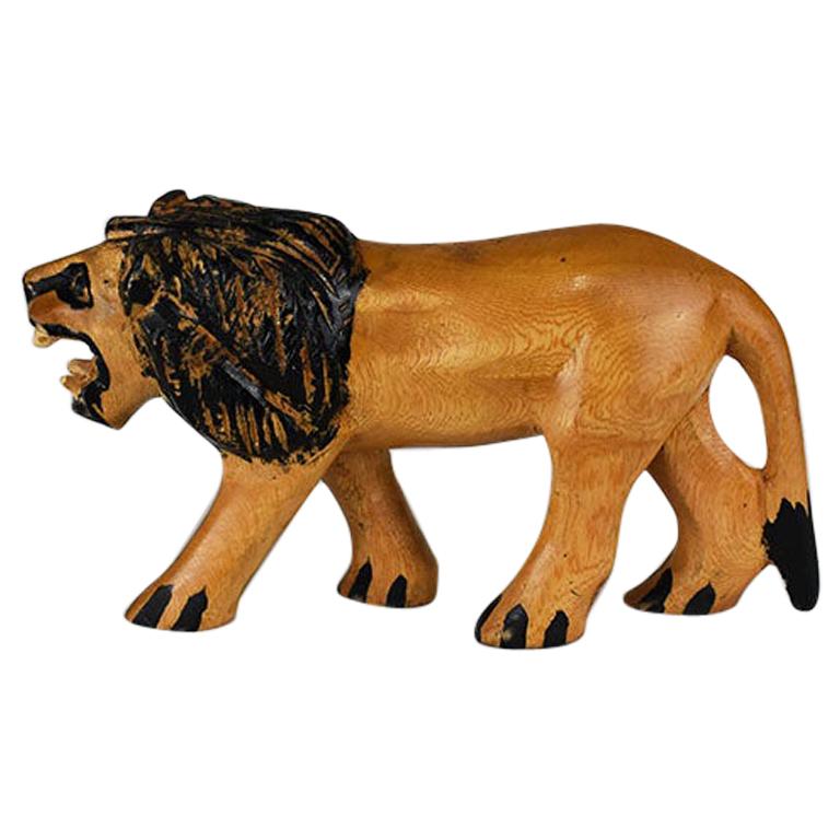 Figure de jouet de lion en bois sculptée à la main orange et noire, Afrique, 1970 en vente