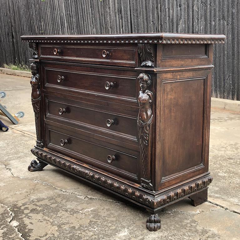 An extraordinary and very handsome large scale late 17th-early 18th century solid wood Renaissance commode with beautiful hand carved reliefs of mermaids and rectangular wood top. Purchased in France.

This beautiful wood commode includes 4 wide