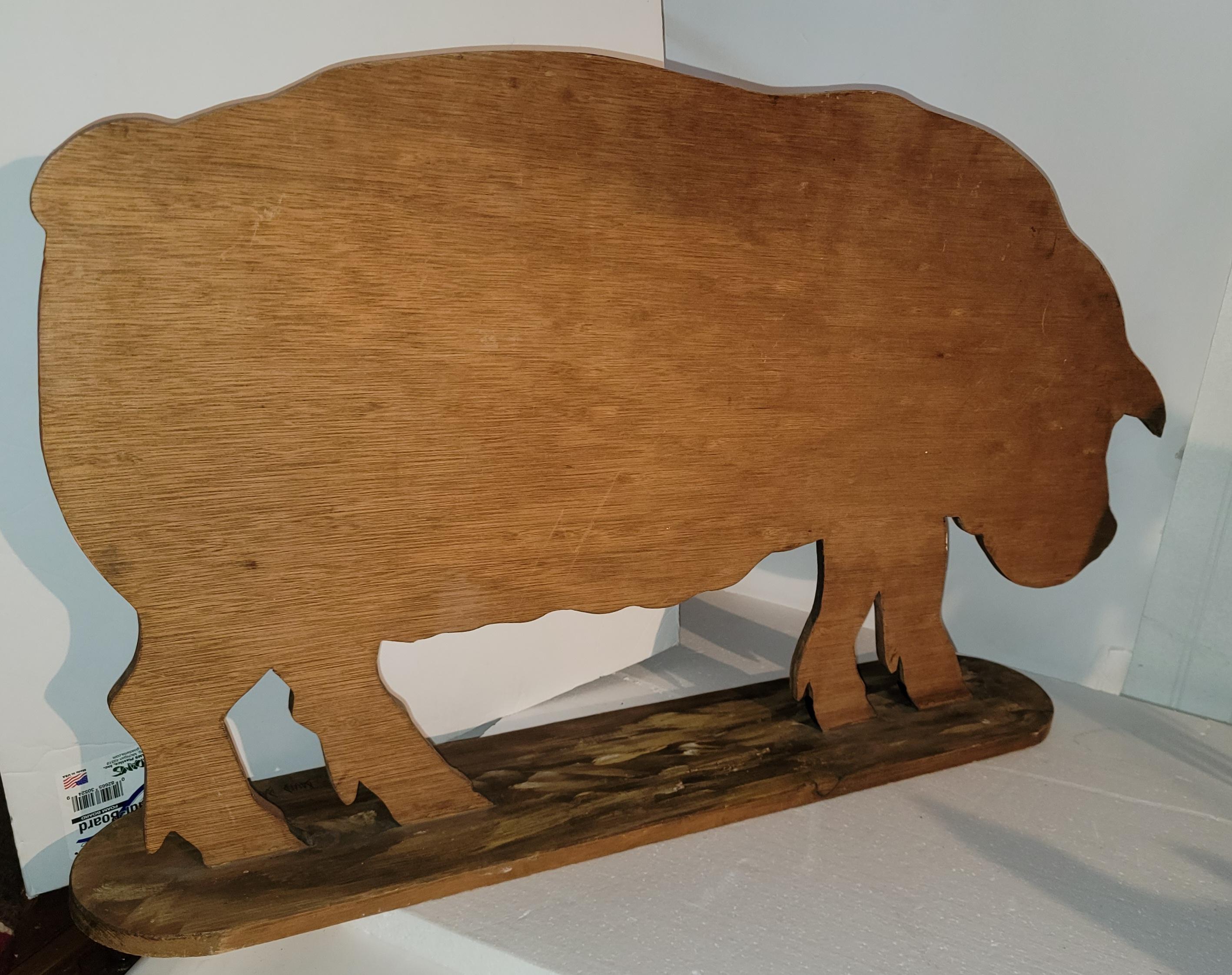 Hand carved wooden pig with original paint. Signed David Barber. Very well done.
33 W x 19.5 H x D.