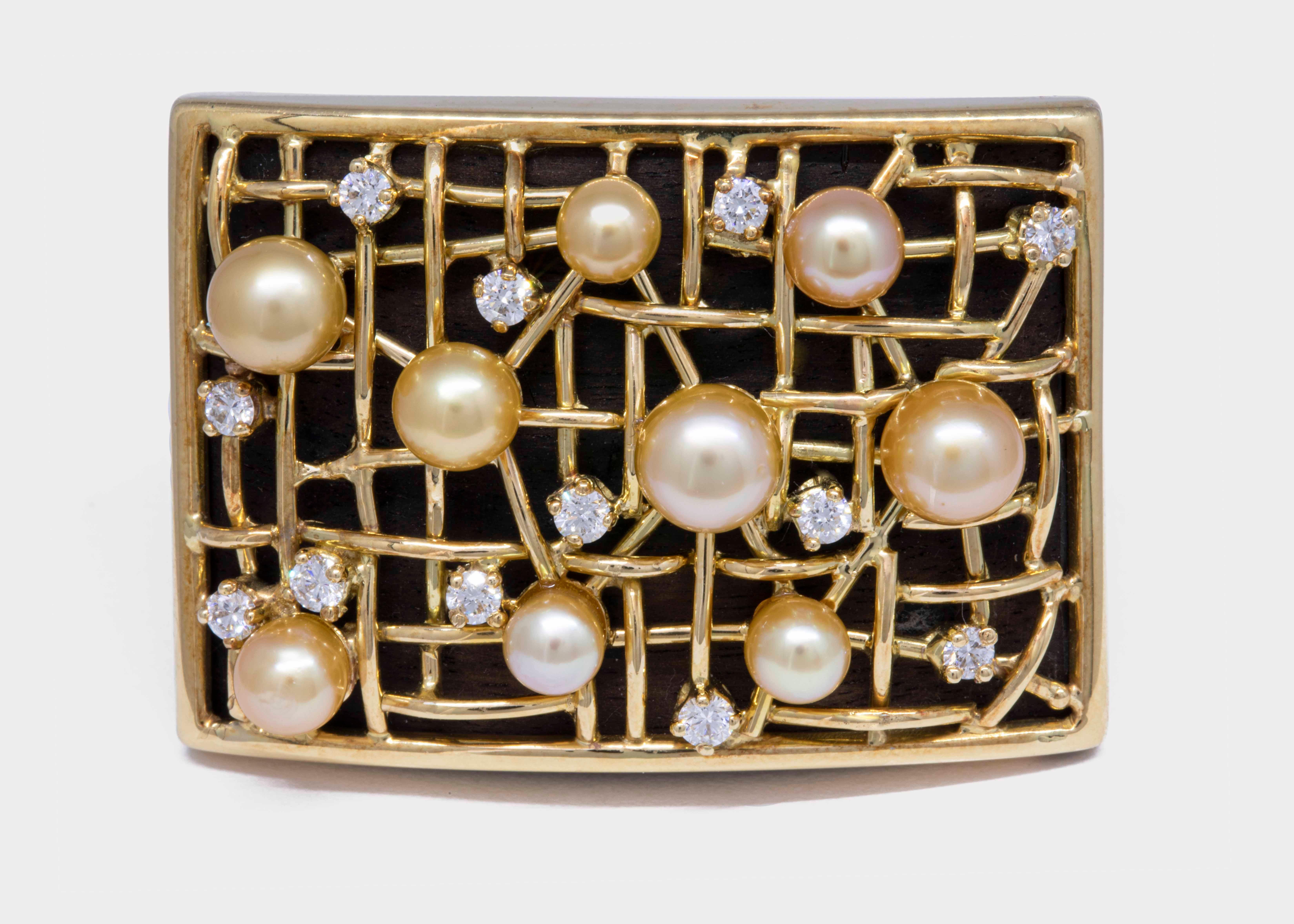 A unique ring made of wood, 18k yellow gold, diamonds and of course 9 natural Bahraini Pinctada Radiata pearls.


Gold Weight: 10.9 g
9 Pearls Weight: 8.4 ct.
Diamonds Weight: 0.46 ct.

