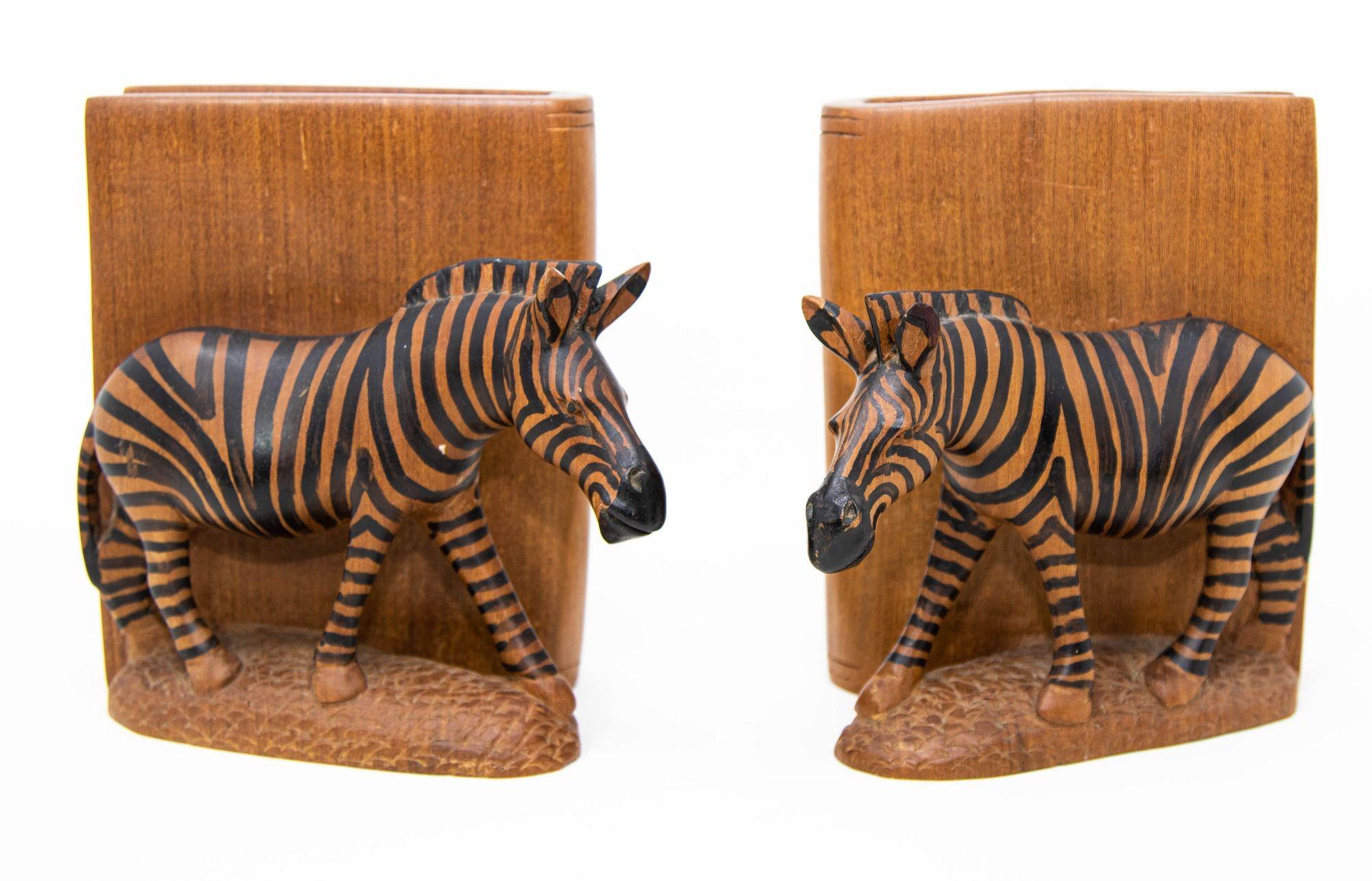 Nice pair of hand carved heavy wood bookends African Safari Zebra sculptures, Handmade in Kenya Circa 1950.
Vintage African Safari hand-carved wood Zebra library bookends.
Finely hand carved and hand painted elephant bookends.
Each zebra sculpture