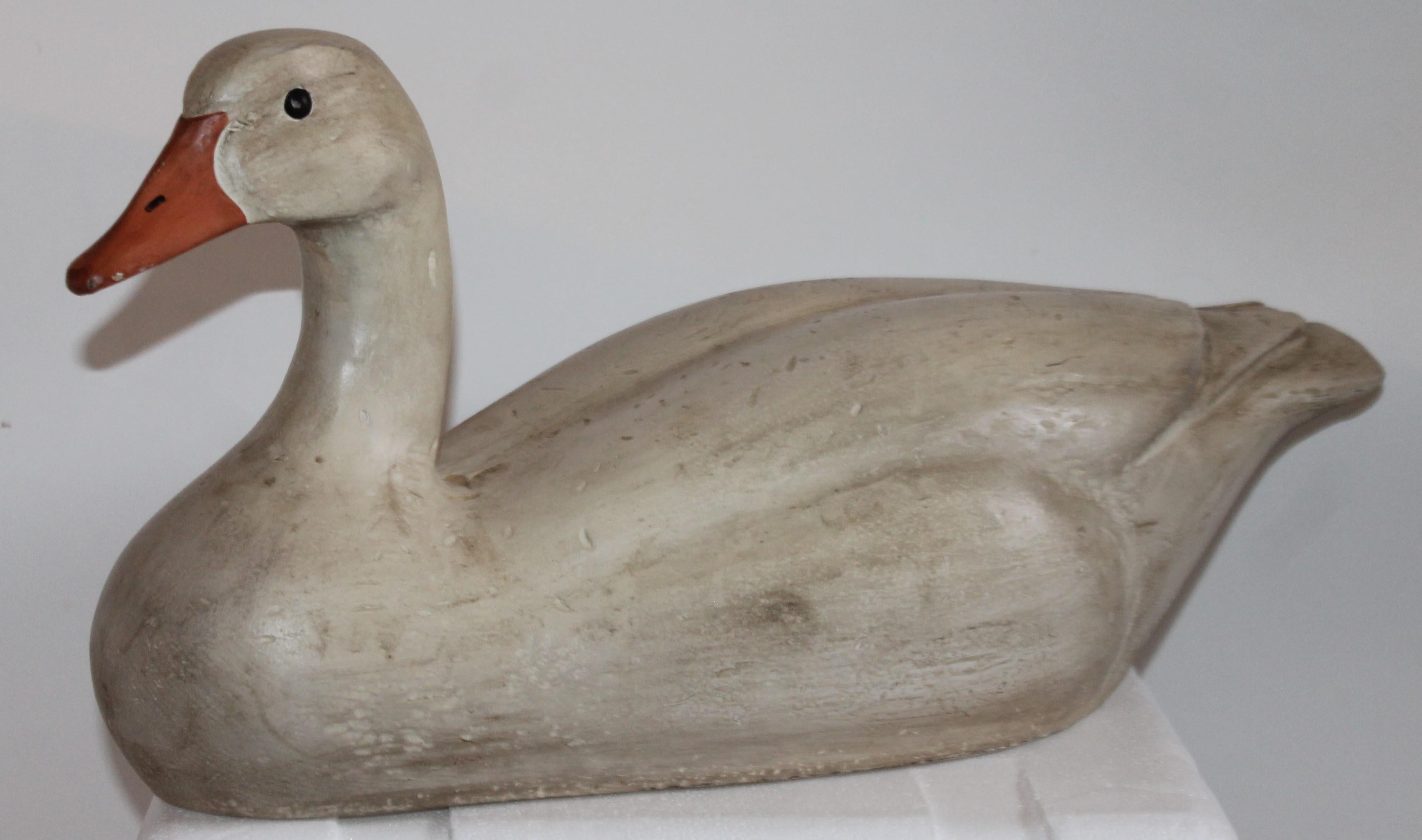 This hand carved and painted swan is signed and dated from Canada. Signed folk art duck JZ dated 1976. Fantastic painted surface and great form.