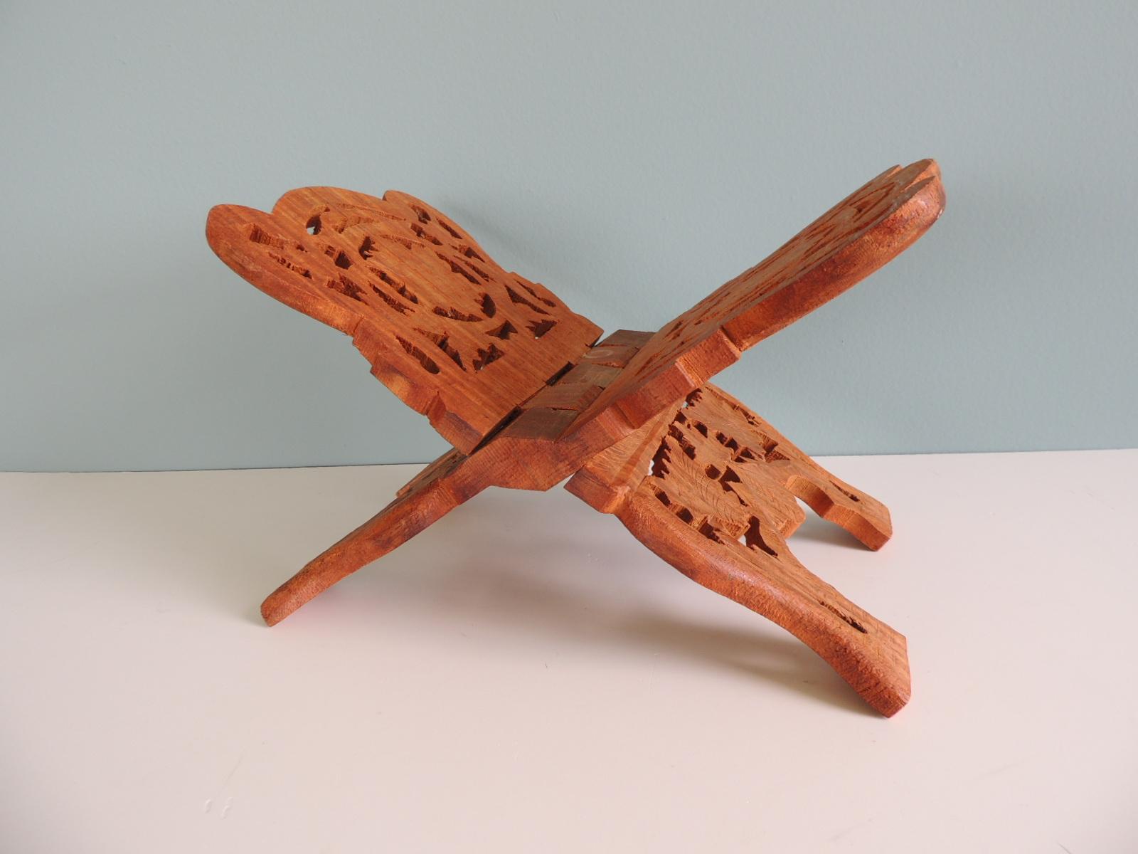 Hand carved wood vintage book stand
Folding carved stand made by hand from one solid piece of Sheesham wood: What is Sheesham wood? Also known as Dalbergia sissoo, Sheesham is a fast-growing, sturdy, deciduous tree. In India, Sheesham wood is known