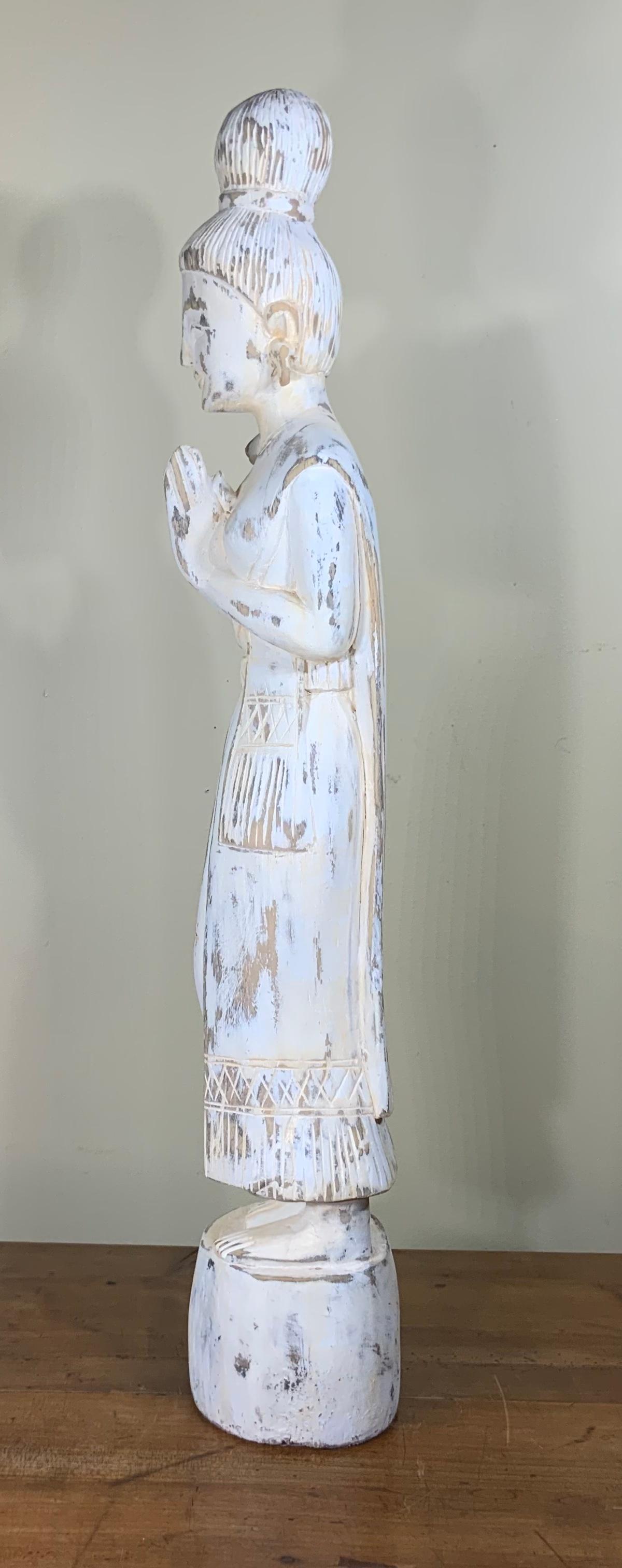 Elegant Quan Yen statue made of hand carved wood, white color finish, beautiful facial expiration, hands forward in grace and goodwill. Exceptional looking dress vivid carving make this beautiful statue a one of a kind object of art to display.
 