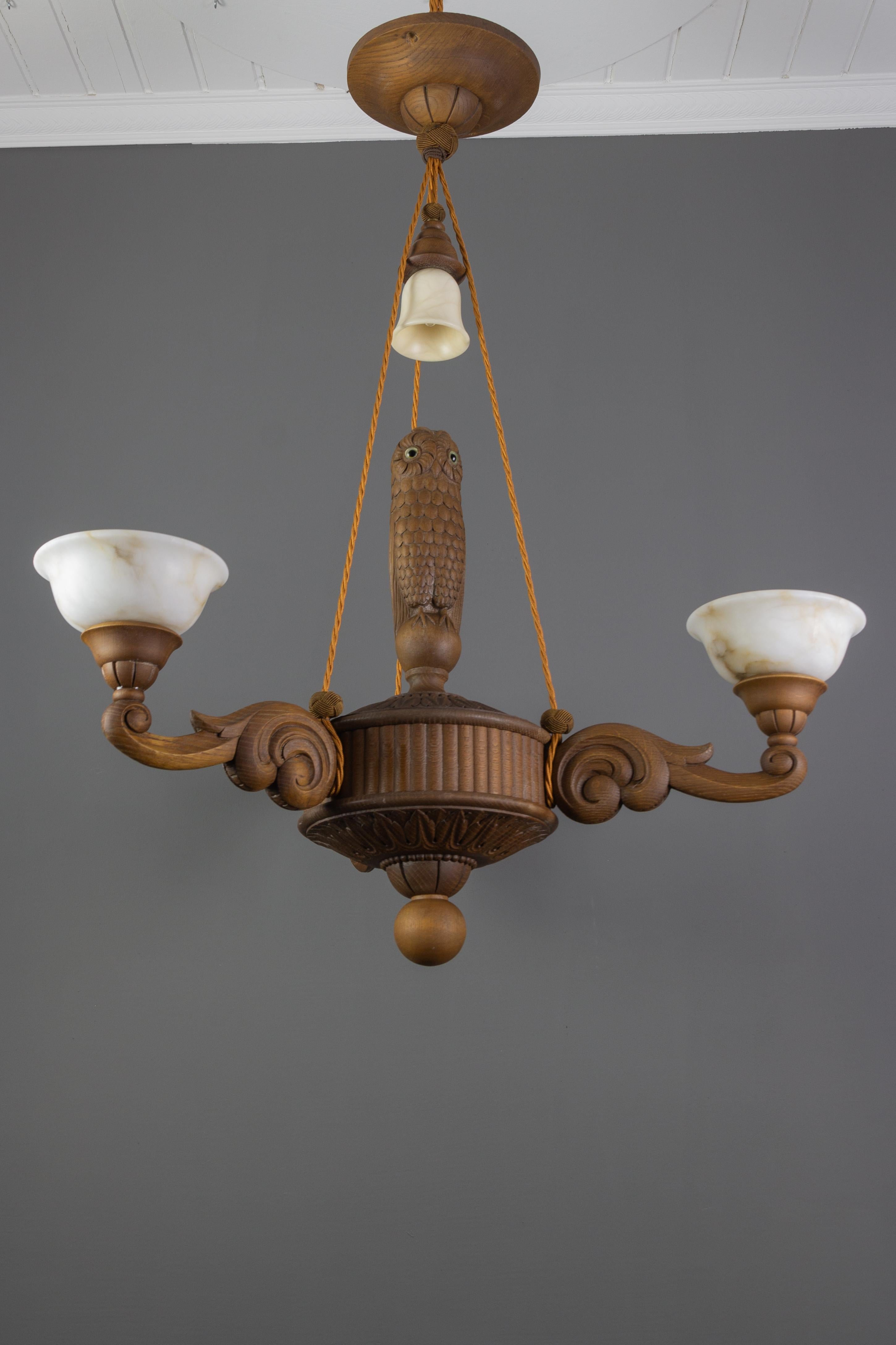 Art Deco Hand Carved Wooden and Alabaster Four-Light Chandelier with Owl Figure, Germany